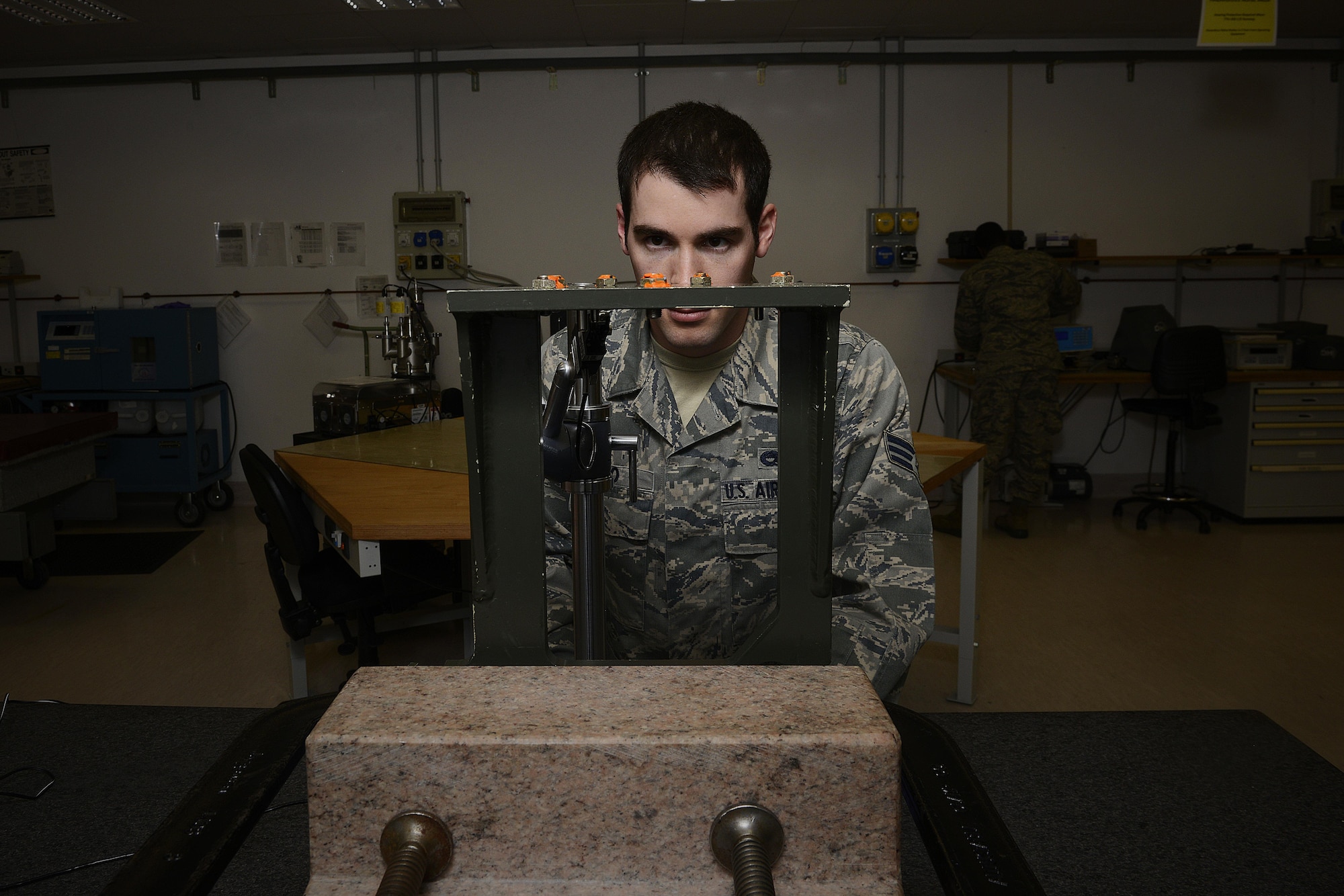 Senior Airman Evan Caso checks the setscrew height on a rate sensor unit boresight, Feb. 10, 2015, at Aviano Air Base, Italy. The precision measurement equipment laboratory (PMEL) Airmen support 5,200 different types of equipment on base for 84 different work centers.  Caso is a 31st Maintenance Squadron PMEL journeyman.  (U.S. Air Force photo/Airman 1st Class Ryan Conroy)