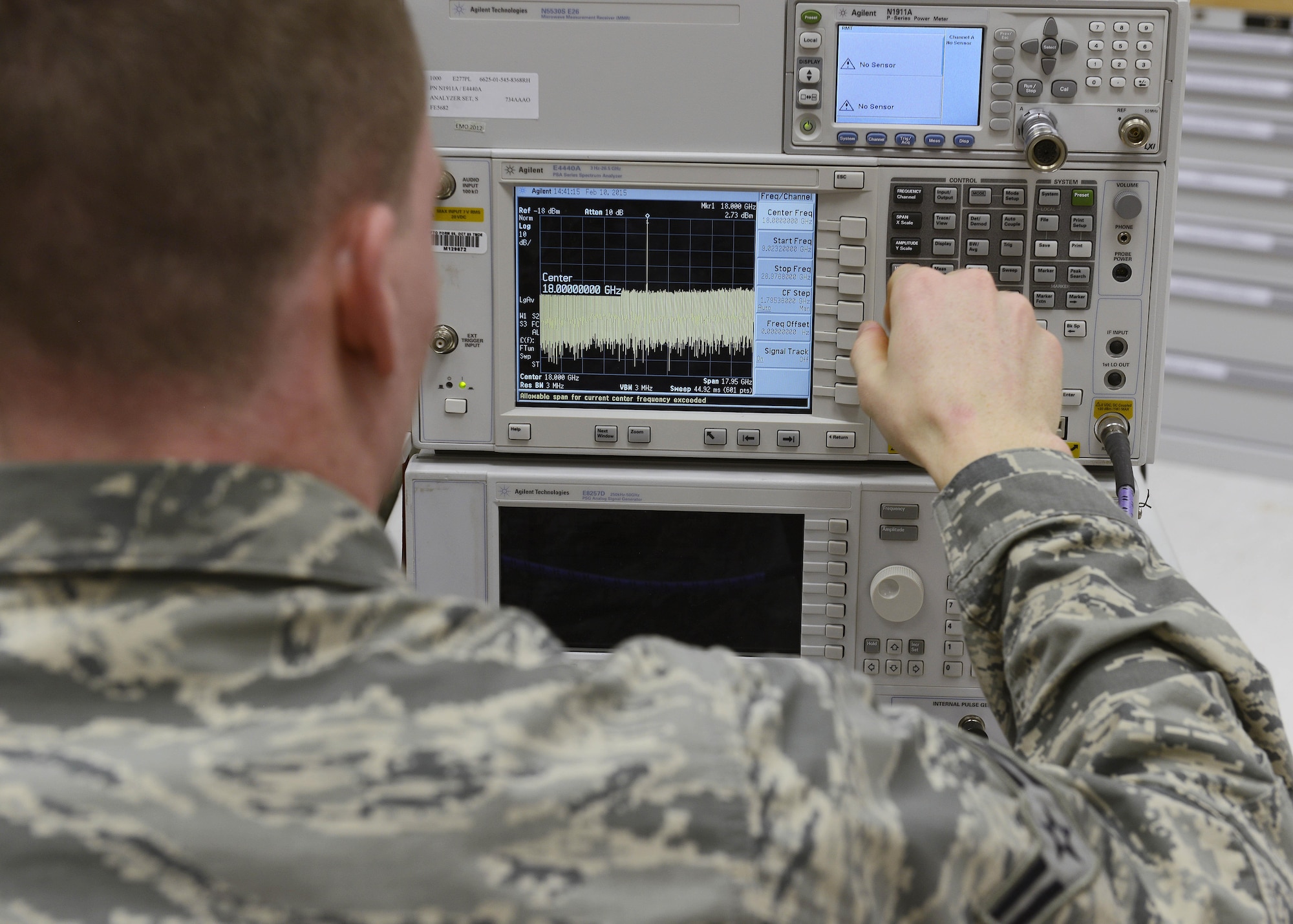 Airman 1st Class Eric Yocom uses a spectrum analyzer to check harmonics during calibration, Feb. 10, 2015, at Aviano Air Base, Italy. Precision measurement equipment laboratory (PMEL) technician’s calibrate and repair measurement and diagnostic equipment to provide customers with reliable, safe and accurate equipment that meets and exceeds expectations. Yocom is a 31st Maintenance Squadron PMEL journeyman.  (U.S. Air Force photo/Airman 1st Class Ryan Conroy)