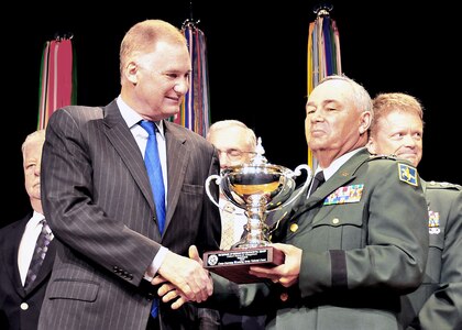 Army Maj. Gen. Ed Wright, the adjutant general of Wyoming, accepts the Secretary of Defense 2010 Environmental Award for Cultural Resources Management from Deputy Secretary of Defense William Lynn III at the Pentagon June 2, 2010.