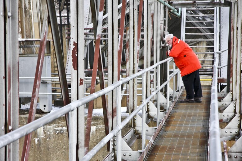 Rich Lockwood, Operations and Regulatory Division chief, looks down on deteriorated lift gates from a catwalk along the Montgomery Locks and dam. 