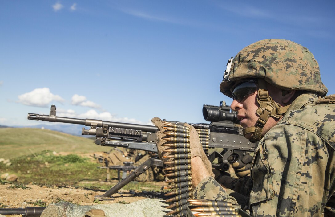 U.S. Marine Lance Cpl. Nick Clancy engages targets with his M240B machine gun during squad tactics and maneuver training aboard Camp Pendleton, Calif., Jan. 27, 2015. Clancy is a team leader with Kilo Company, Battalion Landing Team 3rd Battalion, 1st Marine Regiment, 15th Marine Expeditionary Unit. As the ground combat element for the 15th MEU, BLT 3/1 is preparing for their upcoming deployment by enhancing their combat skills and learning to work as a cohesive unit. (U.S. Marine Corps Photo by Sgt. Emmanuel Ramos/Released)