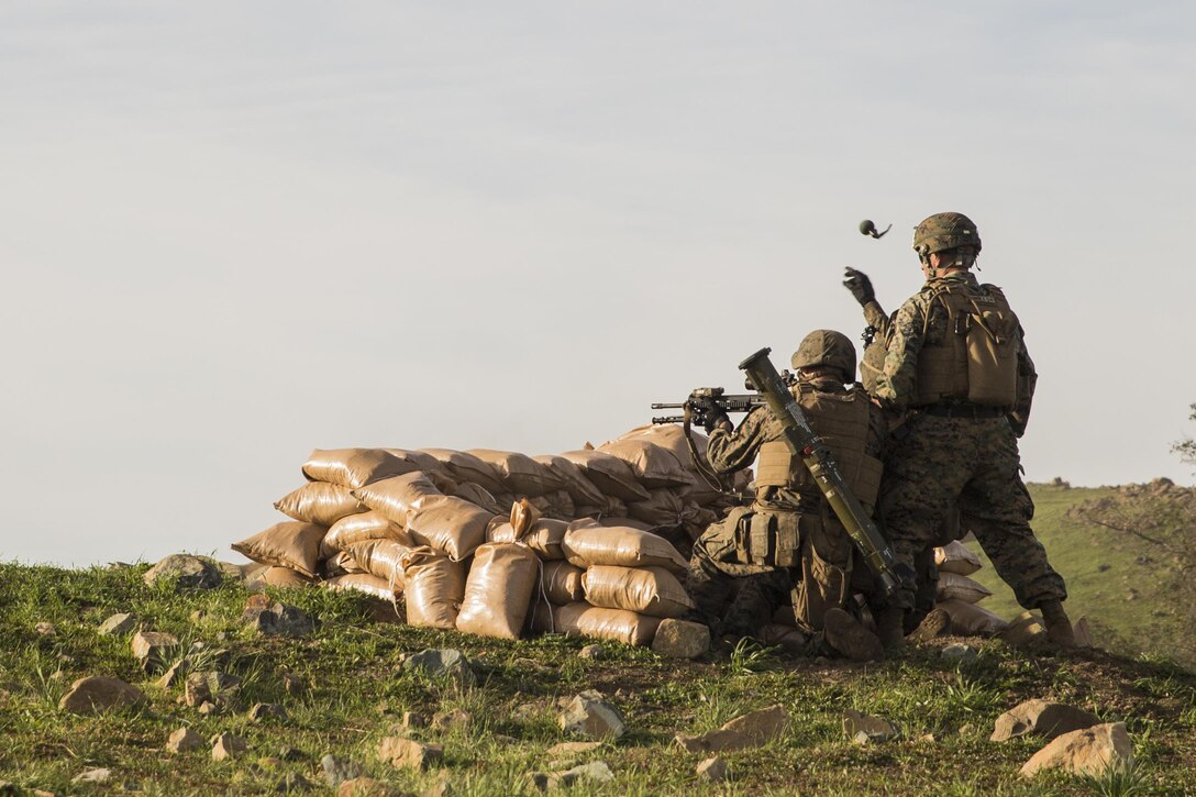 U.S. Marine Lance Cpl. Raul Fosselman throws an M67 grenade at a target during squad tactics and maneuver training aboard Camp Pendleton, Calif., Jan. 28, 2015. Fosselman is a team leader with Kilo Company, Battalion Landing Team 3rd Battalion, 1st Marine Regiment, 15th Marine Expeditionary Unit. As the ground combat element for the 15th MEU, BLT 3/1 is preparing for their upcoming deployment by enhancing their combat skills and learning to work as a cohesive unit. (U.S. Marine Corps Photo by Sgt. Emmanuel Ramos/Released)
