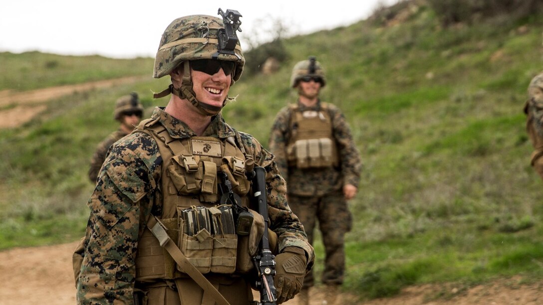 U.S. Marine Lance Cpl.  Alexander Dalziel shares a moment of laughter with his fire team during squad tactics and maneuver training aboard Camp Pendleton, Calif., Jan. 29, 2015. Dalziel is a team leader with Kilo Company, Battalion Landing Team 3rd Battalion, 1st Marine Regiment, 15th Marine Expeditionary Unit. As the ground combat element for the 15th MEU, BLT 3/1 is preparing for their upcoming deployment by enhancing their combat skills and learning to work as a cohesive unit. (U.S. Marine Corps Photo by Sgt. Emmanuel Ramos/Released)