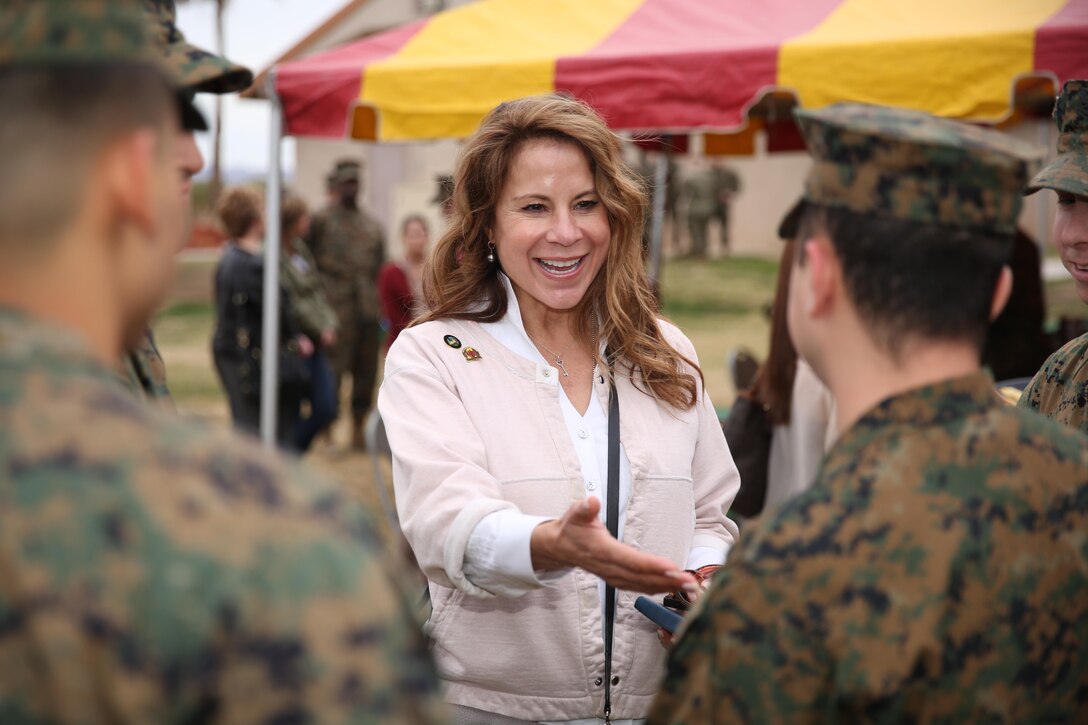 Jan Harnik, council member, City of Palm Desert, meets with corpsman and Marines during the family day portion of the city’s tour of the Combat Center at Desert Winds Golf Course, Jan. 28, 2015. Council members met with Marines, sailors and their families in order to establish their relationship as city and adopted unit. (Official Marine Corps Photo by Lance Cpl. Julio McGraw/Released)