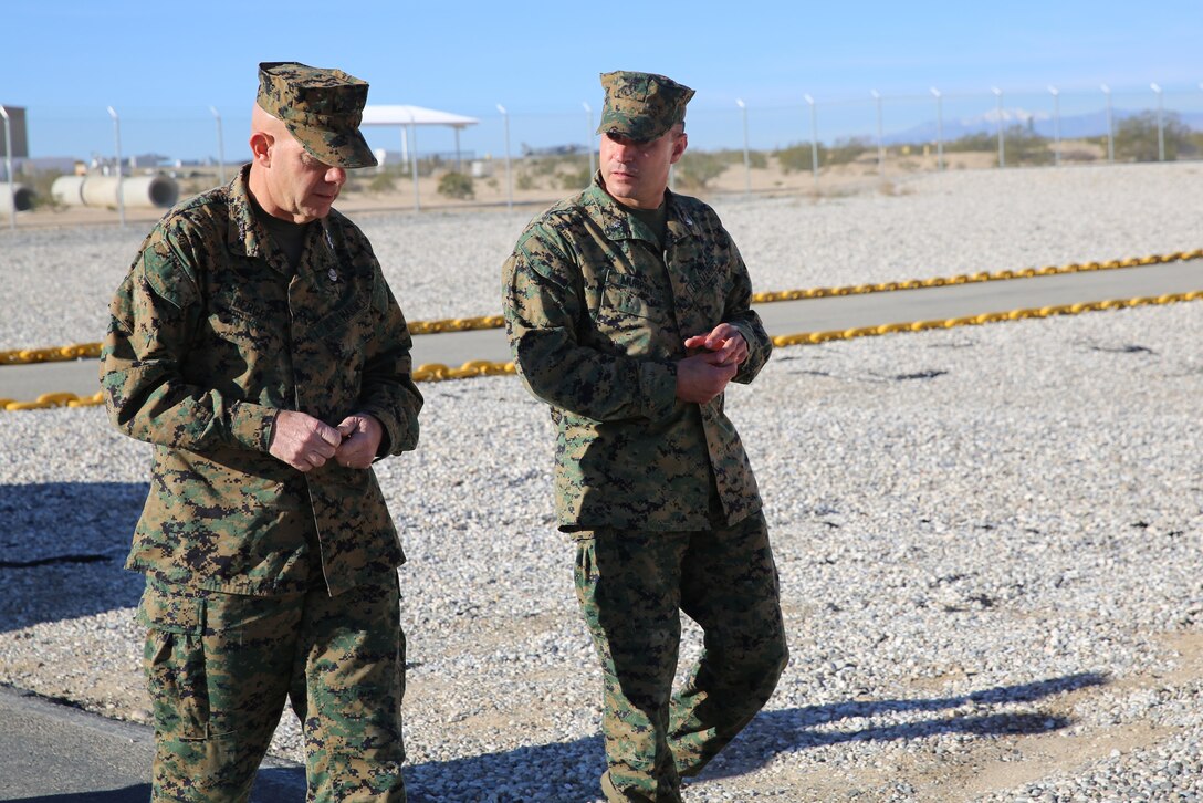 Lt. Gen. David H. Berger, commanding general, I Marine Expeditionary Force talks to Lieutenant Colonel Steven R. Murphy, commanding officer, Marine Wing Support Squadron 374 during his visit to the Combat Center, Feb. 5, 2015. The purpose of his visit was to take a tour of different units in I MEF and receive input from Marines. (Official Marine Corps photo by Lance Cpl. Medina Ayala-Lo/Released)