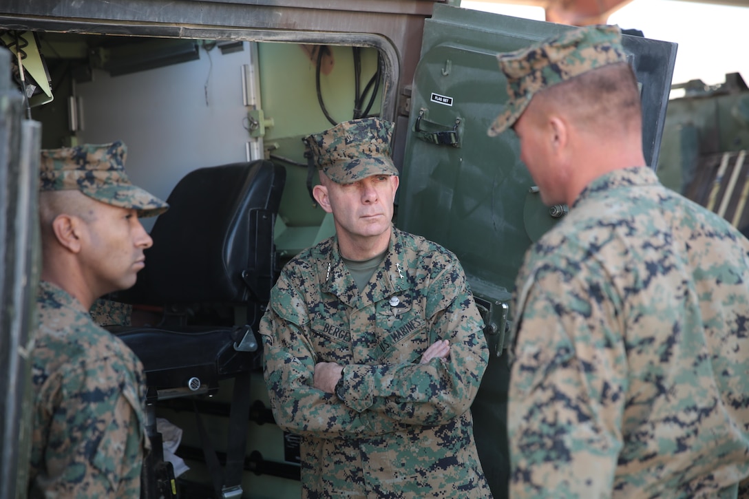 Lt. Gen. David H. Berger, commanding general, I Marine Expeditionary Force listens as Lt. Col Matt Good, commanding officer, 3rd LAR explains some of the capabilities of the Light Armored Vehicle during his visit to the Combat Center, Feb. 5, 2015. (Official Marine Corps photo by Lance Cpl. Medina Ayala-Lo/Released)