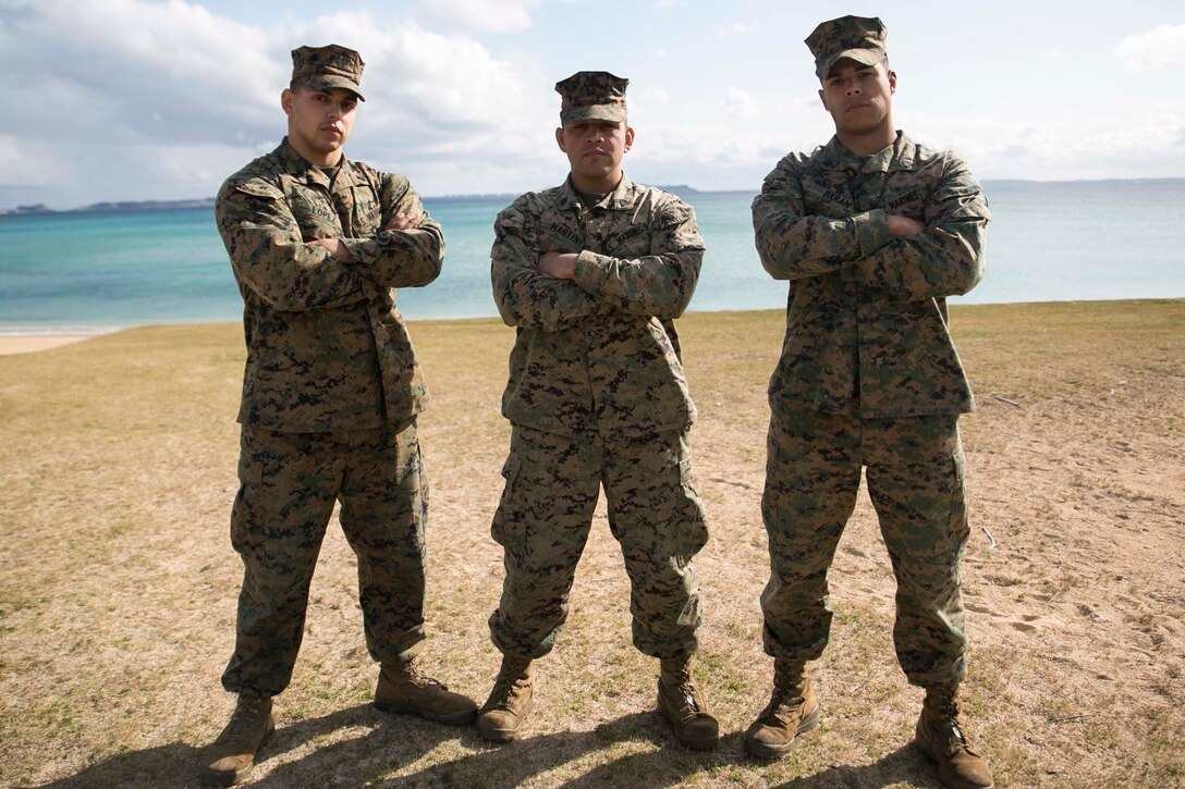 Sgts. David A. Lopez, left, Roberto A. Martinez, center, and Paul A. Baran pose for a photo Feb. 9 at Kin Blue Training Area. The three sergeants gave their keys to success as small unit leaders in the Marine Corps. Lopez, from Blue Island, Illinois, is a data systems technician. Martinez, from Sterling, Illinois, is a motor transport operator. Baran, from Vancouver, Washington, is a ground radio repairer. The Marines are with Combat Logistics Regiment 3, 3rd Marine Logistics Group, III Marine Expeditionary Force.