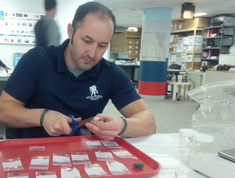 Marine Veteran Ryan Schatz processes prehistoric items at the Mandatory Center of Expertise for the Curation and Management of Archaeological Collections at the U.S. Army Corps of Engineers St. Louis District.
