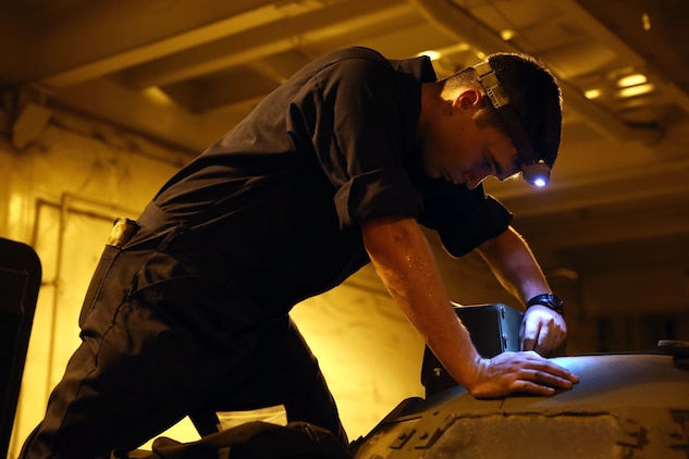 Cpl. Brock W. English with the Offload Preparation Party ensures all parts are operational on the Assault Amphibious Vehicles aboard the Maritime Prepositioning Force ship, USNS Pililaau, Feb. 6. The OPP Marines conducted pre-operation checks on all of the vehicles aboard the ship. Their mission is to prepare and offload the equipment from ship 
to shore for use during Exercise Cobra Gold 2015. Cobra Gold is an annual Thailand /United States, co-sponsored multinational and joint theater security cooperation exercise, conducted in the Kingdom of Thailand. This year 25 nations are participating. English is an AAV crewman with General Support Platoon, and a Lampasas, Texas, native. 