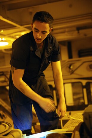 Cpl. Tomas X. Martinez with the Offload Preparation Party ensures all parts are operational on the Assault Amphibious Vehicles aboard the Maritime Prepositioning Force ship, USNS Pililaau, Feb. 6. The OPP Marines conducted pre-operation checks on all of the vehicles aboard the ship. Their mission is to prepare and offload the equipment from ship to shore for use during Exercise Cobra Gold 2015. Cobra Gold is an annual Thailand /United States, co-sponsored multinational and joint theater security cooperation exercise, conducted in the Kingdom of Thailand. This year 25 nations are participating. Martinez is an AAV crewman with with General Support Platoon, and a San Francisco, California, native. 