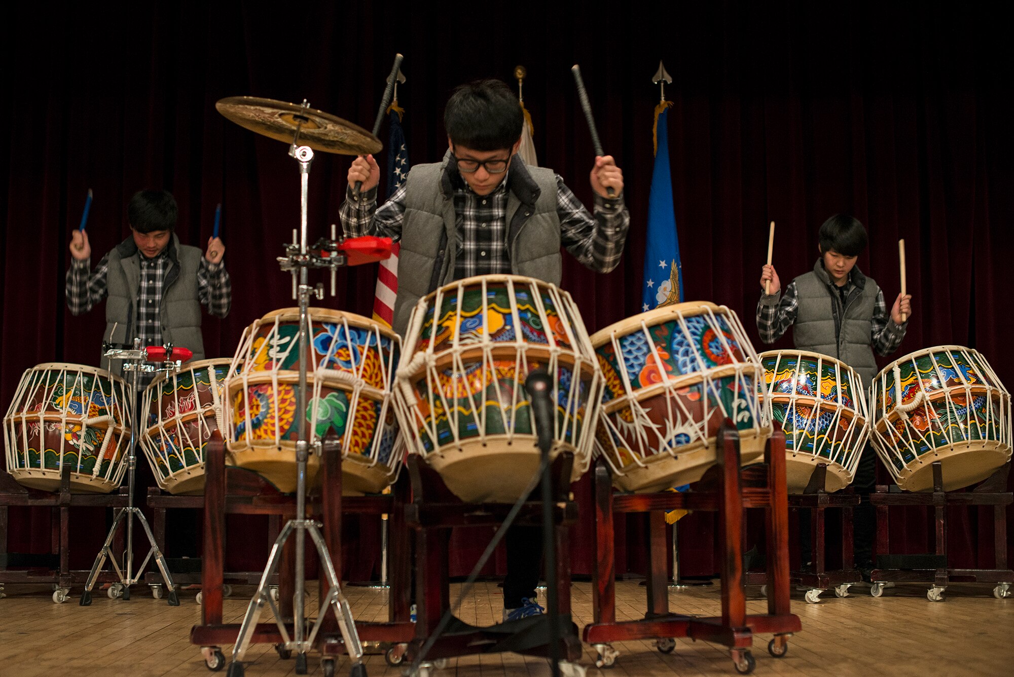 The Nanta Dream Team performs on their drums during the National Prayer Breakfast Feb. 12, 2015, at Osan Air Base, Republic of Korea. The NPB is designed to celebrate religious diversity. (U.S. Air Force photo by Staff Sgt. Jake Barreiro/Released)