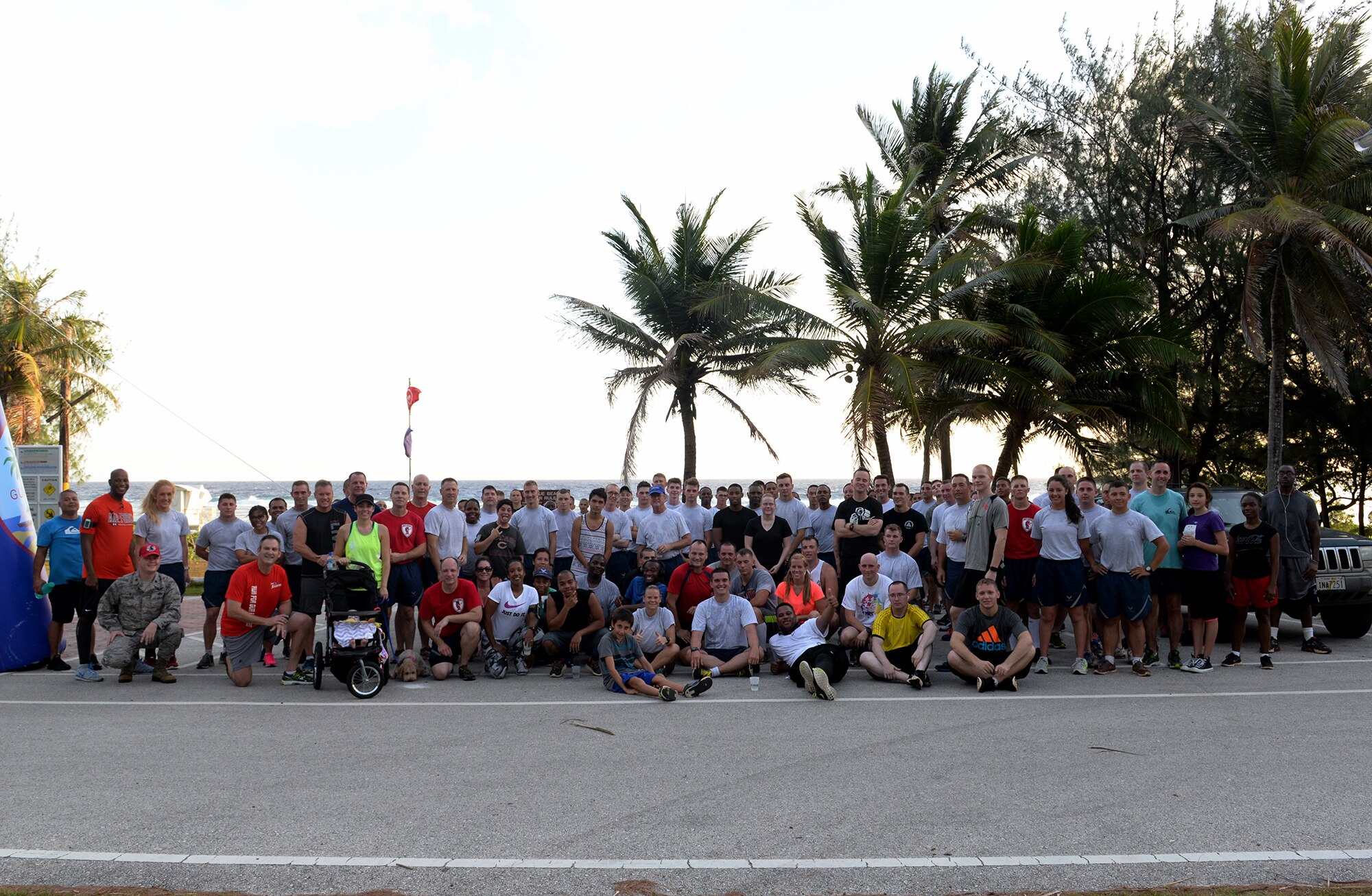Members of Team Andersen gather for a group photo after completing the I Love to Run 5K hosted by Coral Reef Fitness Center Feb. 11, 2015 at Tarague Beach at Andersen Air Force Base, Guam. More than 180 people came to participate in the 5K and the top four male and female finishers were presented awards at the finish line.  (U.S. Air Force photo by Senior Airman Amanda Morris/Released.)