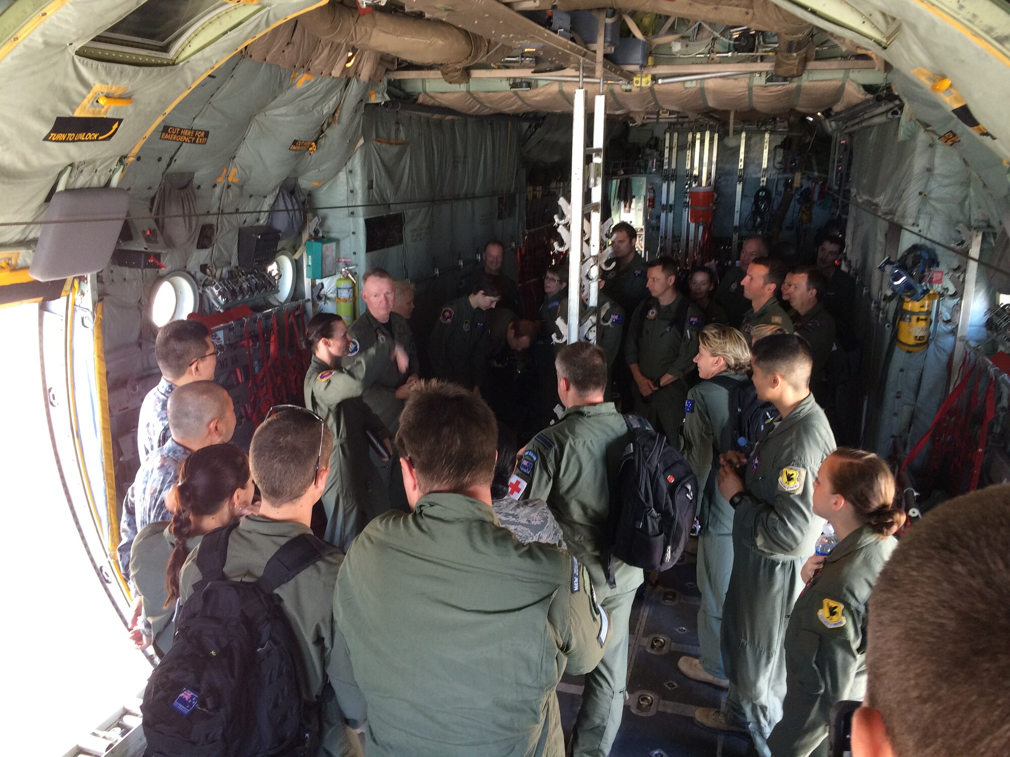 Members from Yokota Air Base's 36th Airlift Squadron and Kadena Air Base's
18th Aeromedical Evacuation Squadron conduct C-130H aircraft familiarization and egress
training with members of the Royal Australian Air Force, Royal New Zealand
Air Force and Japanese Air Self Defense Force at Andersen Air Force Base,
Guam, Feb. 12 , 2015. The training prepared aeromedical
personnel from across the Pacific for an Exercise COPE NORTH HA/DR scenario
which begins Feb. 15. (Courtesy photo U.S. Air Force)
