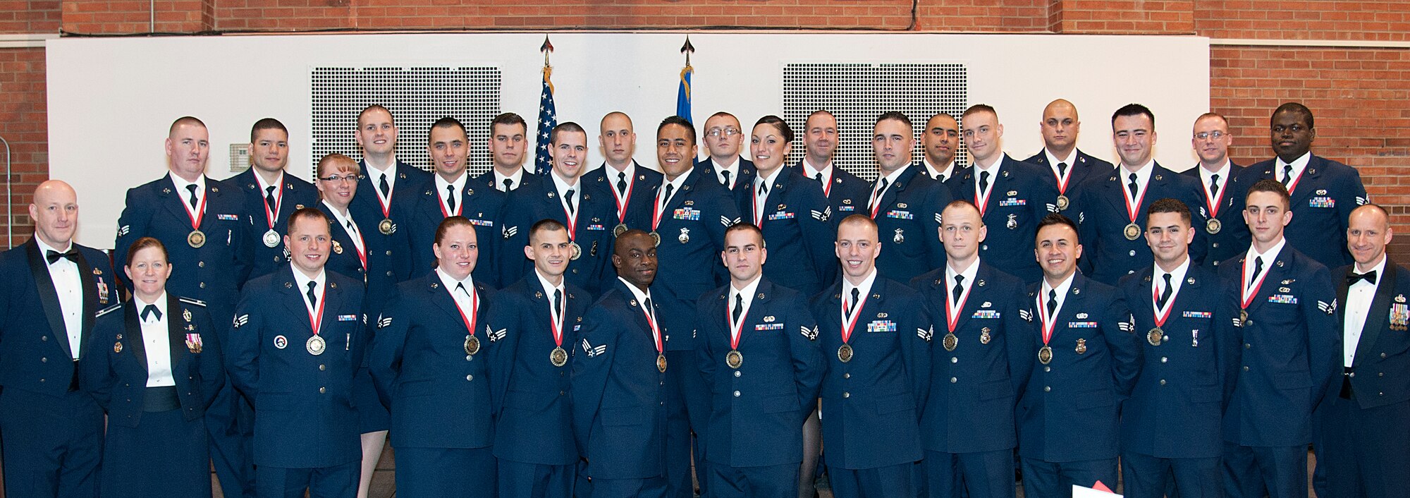 Col. Tracey Hayes, 90th Missile Wing commander; Chief Master Sgt. Samuel Couch, 90th Missile Wing command chief; and Chief Master Sgt. Steven Thompson, 90th Security Forces Squadron security forces manager, pose with Airman Leadership School Class 15-C Feb. 11, 2015, on F.E. Warren Air Force Base, Wyo. ALS is a six-week course designed to prepare Airmen to assume supervisory duties as well as instruction in the practice of leadership and followership. Enlisted Airmen must graduate ALS before supervising other Airmen. (U.S. Air Force photo by Senior Airman Jason Wiese)