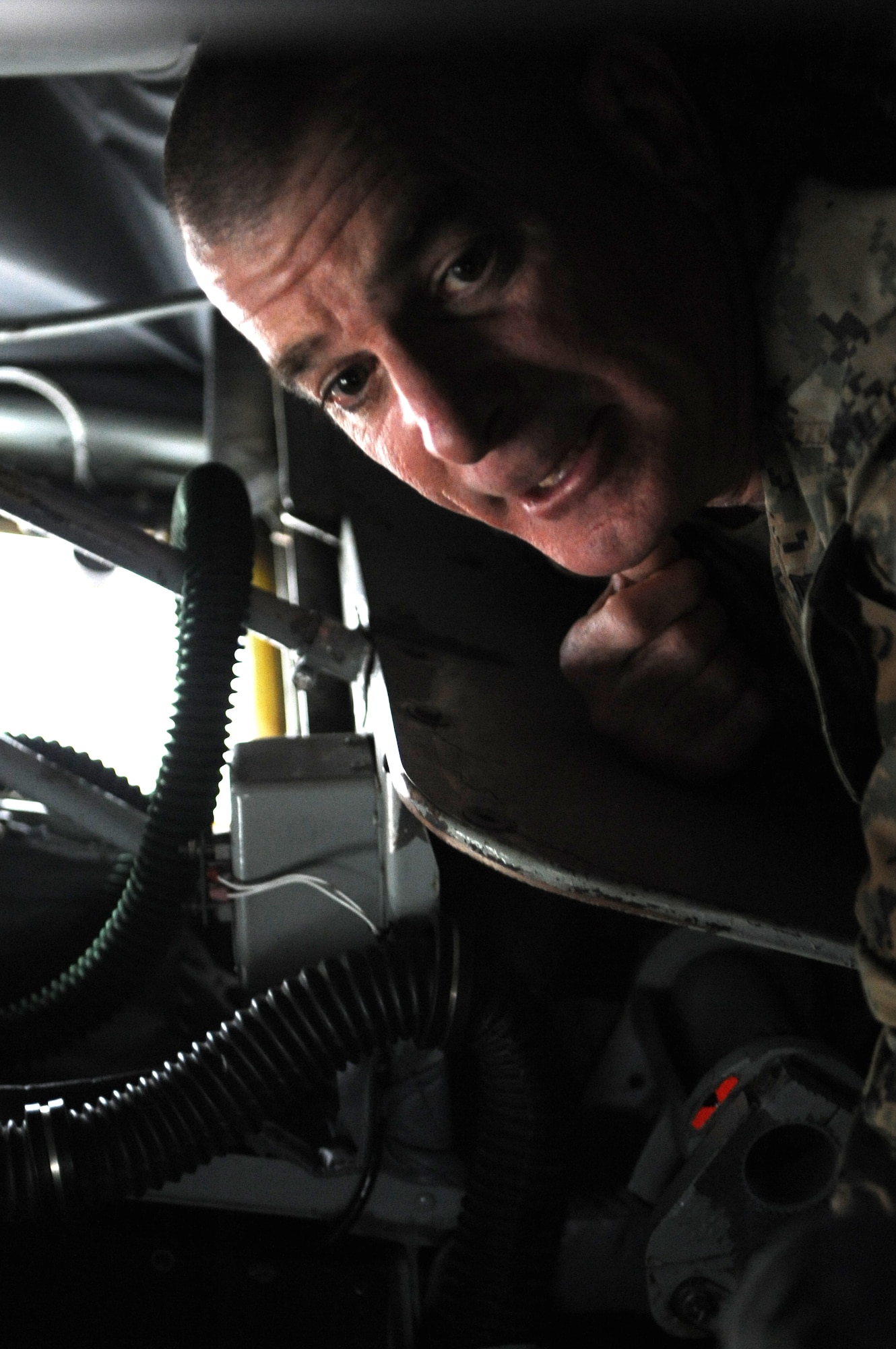 U.S. Marine Sgt. Maj. Bryan Battaglia, senior enlisted advisor to the chairman of the Joint Chiefs of Staff, looks around the boom pod of a KC-135 Stratotanker on Kadena Air Base, Japan, Feb. 8, 2015. Battaglia toured several squadrons on Kadena and is scheduled to continue visiting troops across the Pacific for the next couple of days before returning to the Pentagon. (U.S. Air Force photo by Airman 1st Class Stephen G. Eigel)