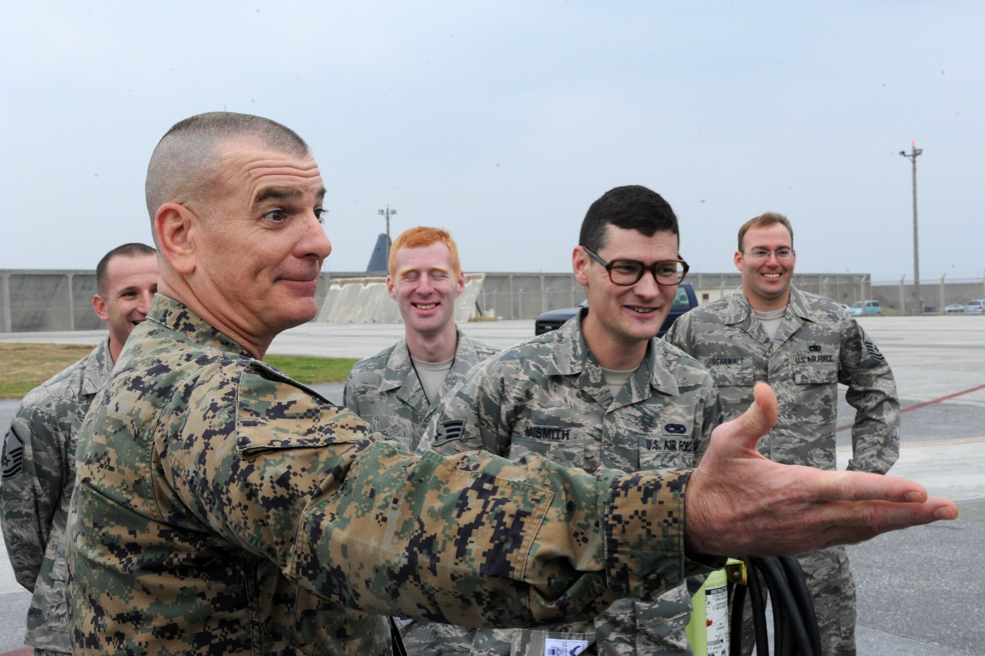 U.S. Marine Sgt. Maj. Bryan Battaglia, senior enlisted advisor to the chairman of the Joint Chiefs of Staff, interacts with members of the 718th Aircraft Maintenance Squadron on Kadena Air Base, Japan, Feb. 8, 2015. They showed Battaglia the KC-135, E-3 Sentry and HH-60 aircraft and explained their multiple roles and importance to Team Kadena. (U.S. Air Force photo by Airman 1st Class Stephen G. Eigel)