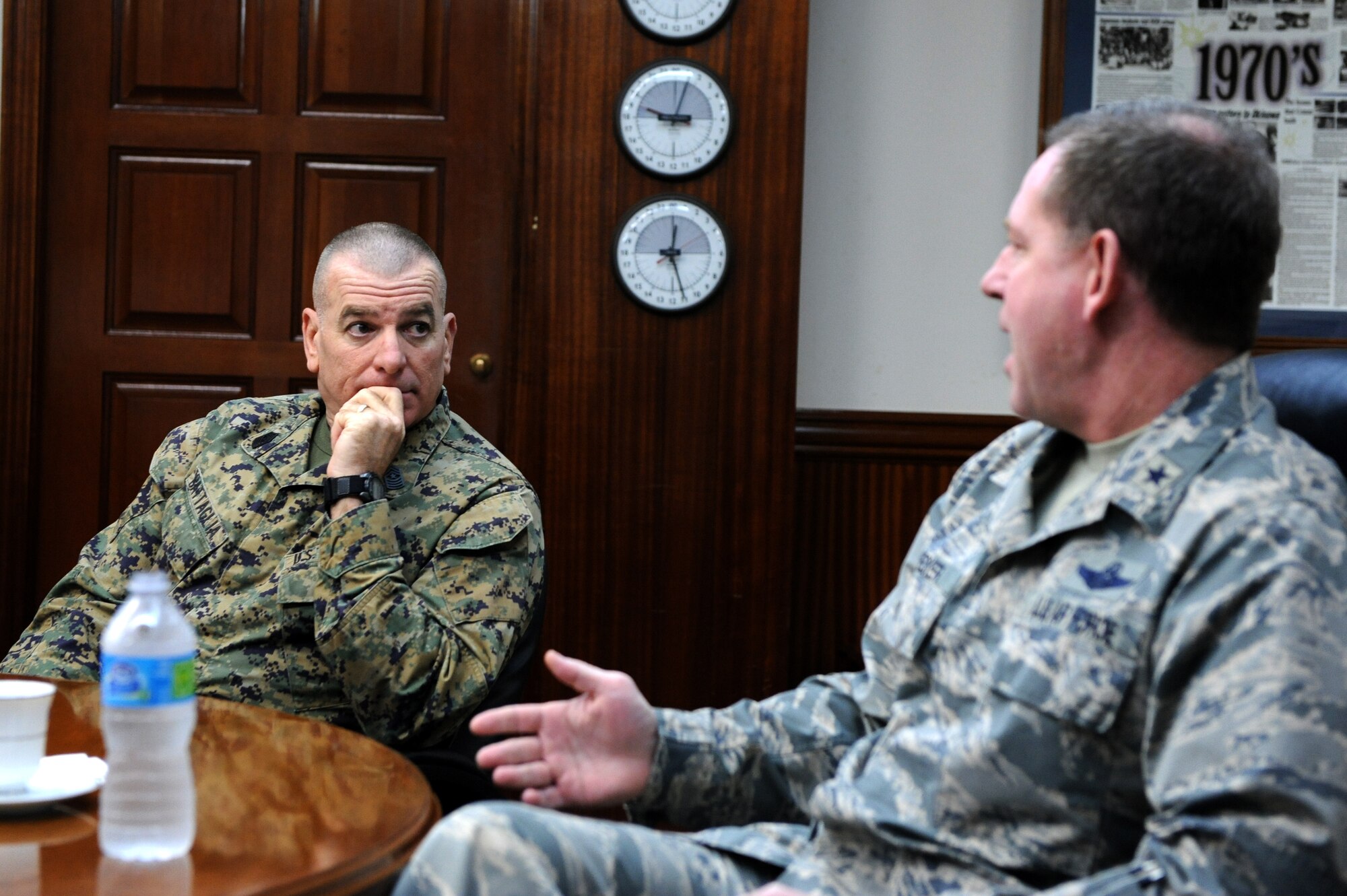 U.S. Marine Sgt. Maj. Bryan Battaglia, senior enlisted advisor to the chairman of the Joint Chiefs of Staff, listens as U.S. Air Force Brig. Gen. James B. Hecker, 18th Wing commander, talks about the mission of Kadena Air Base, Japan, Feb. 8, 2015. Battaglia came to Kadena to visit service members and see how Team Kadena’s mission is carried out. (U.S. Air Force photo by Airman 1st Class Stephen G. Eigel)