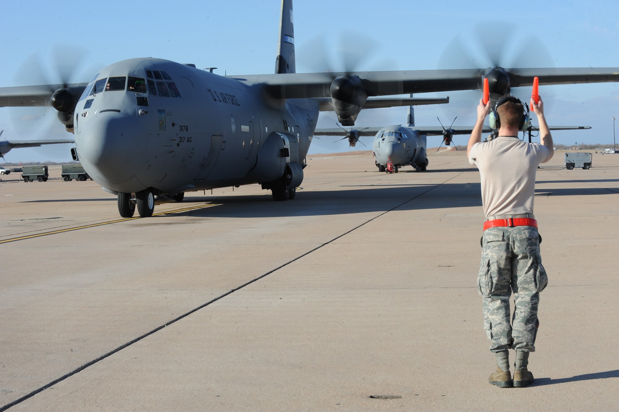 A Dyess Airman taxis a C-130J Super Hercules on the flightline Feb. 4, 2015, at Dyess Air Force Base, Texas. More than 35 Airmen from Dyess and two C-130Js deployed Oct. 29, 2014, in support of Operation United Assistance, where they were tasked with moving medical supplies, personnel and equipment as part of a comprehensive effort led by the U.S. Agency for International Development to respond and contain the outbreak of the Ebola virus in West Africa. (U.S. Air Force photo by Senior Airman Shannon Hall/Released)