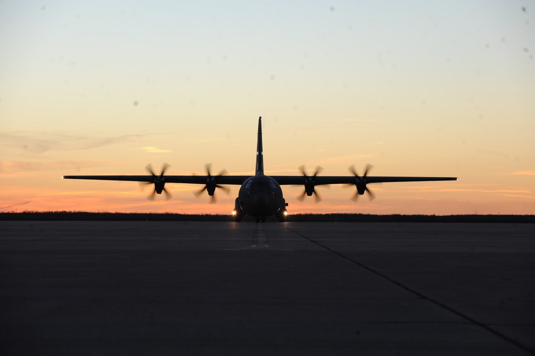 A C-130J Super Hercules taxis onto the runway after returning from Ramstein Air Base, Germany, Jan. 18, 2015, at Dyess Air Force Base, Texas. Twenty-nine Airmen deployed to Germany to serve in Bravo alert status for the Air Force European Command, allowing the Airmen to deliver a quick response team for humanitarian missions and combat support when necessary. (U.S. Air Force photo by Alexander Guerrero/Released)