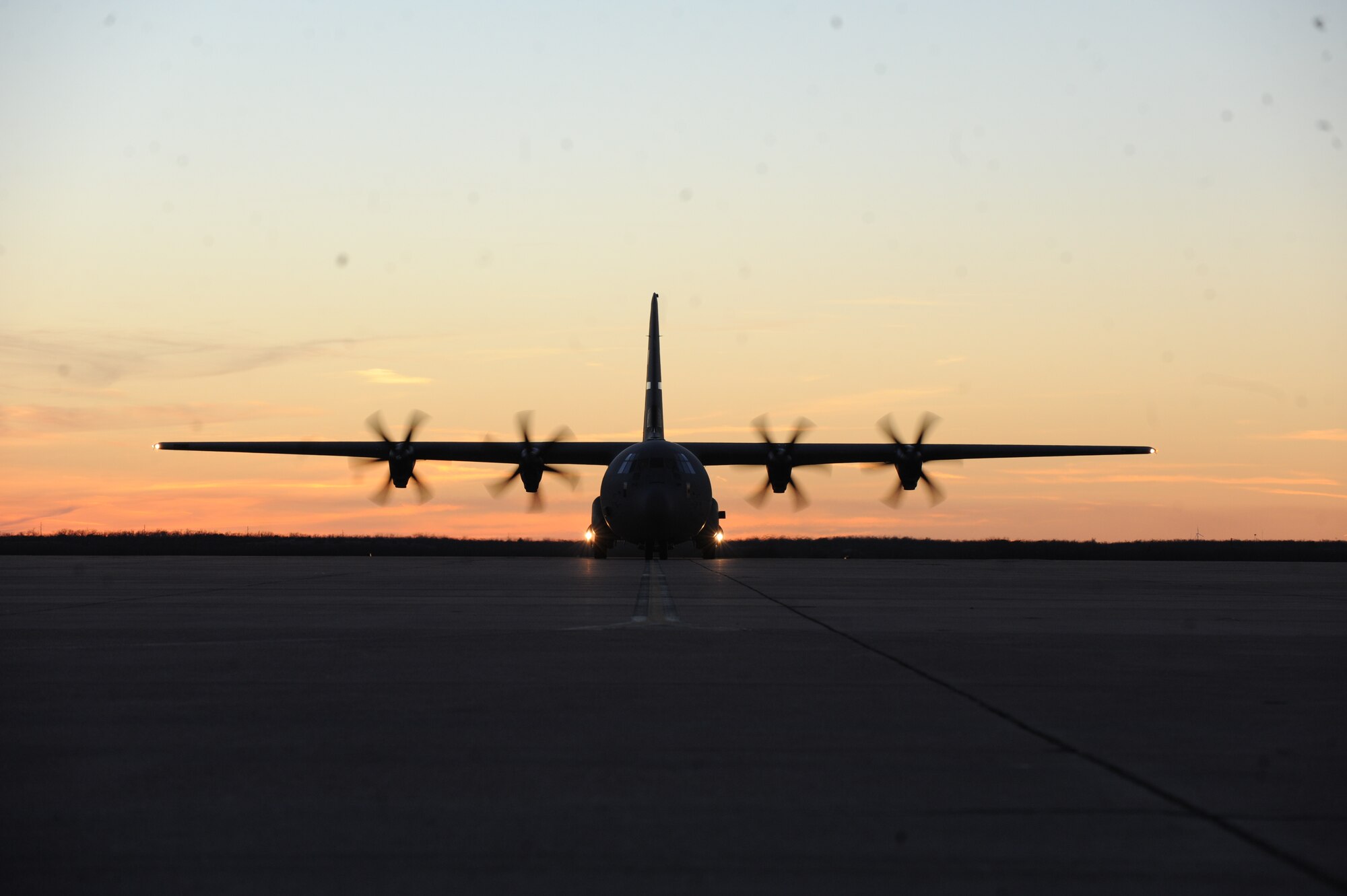 A C-130J Super Hercules taxis onto the runway after returning from Ramstein Air Base, Germany, Jan. 18, 2015, at Dyess Air Force Base, Texas. Twenty-nine Airmen deployed to Germany to serve in Bravo alert status for the Air Force European Command, allowing the Airmen to deliver a quick response team for humanitarian missions and combat support when necessary. (U.S. Air Force photo by Alexander Guerrero/Released)