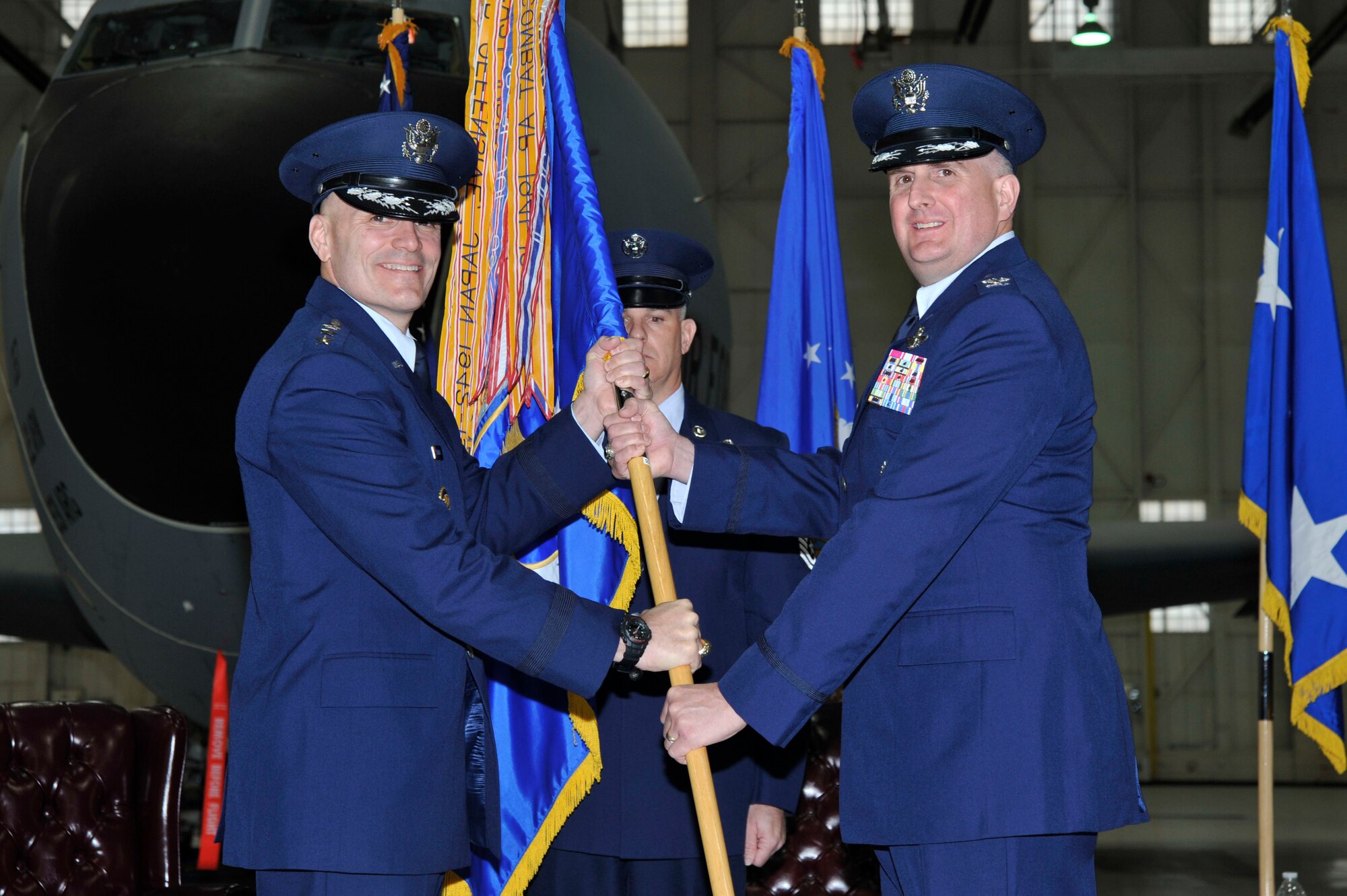 Lt. Gen. Carlton D. Everhart II, 18th Air Force commander, passes the 22nd Air Refueling Wing guidon to Col. Albert Miller, during a change of command ceremony, Feb. 12, at McConnell Air Force Base, Kan. Miller took command of the 22nd ARW after previously serving as the commander of the 515th Air Mobility Operations Wing at Joint Base Pearl Harbor-Hickham, Hawaii. (U.S. Air Force photo by Airman 1st Class Christopher Thornbury)
