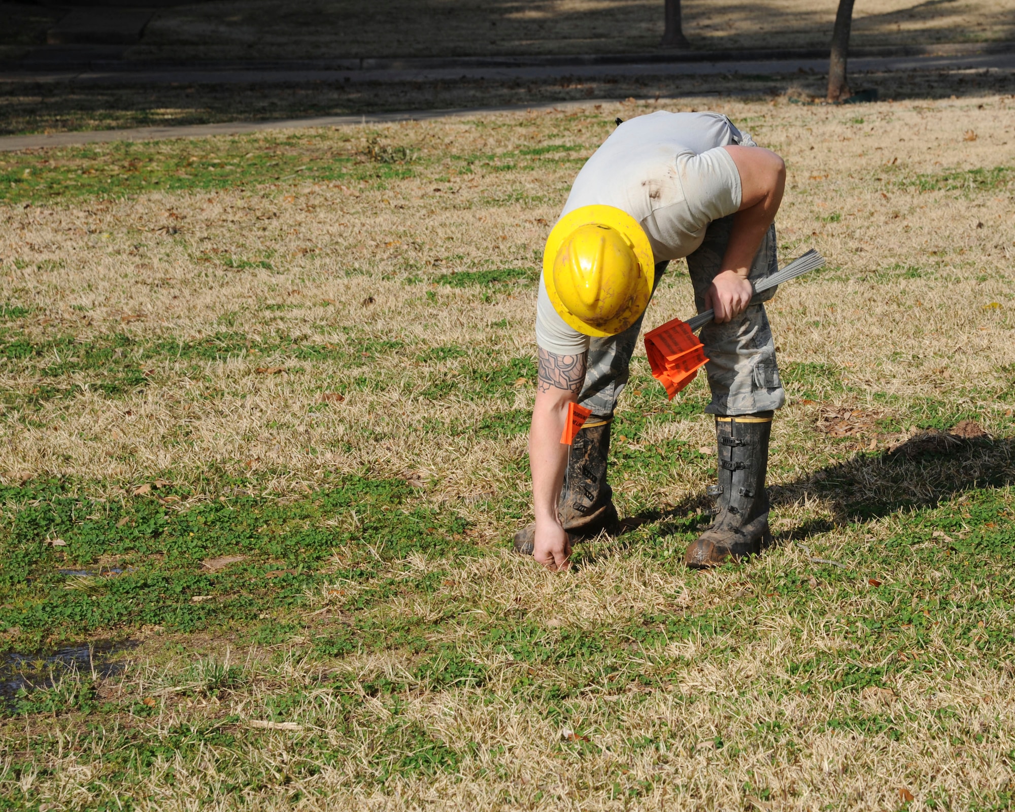 Airman 1st Class Tyler Tanner, 2nd Communications Squadron cable and antenna systems, marks buried cables on Barksdale Air Force Base, La., Feb. 11, 2015. It’s critical for Cable Dawgs Airmen to mark lines accurately to prevent damage to communication cables. (U.S. Air Force photo/ Senior Airman Jannelle Dickey)
