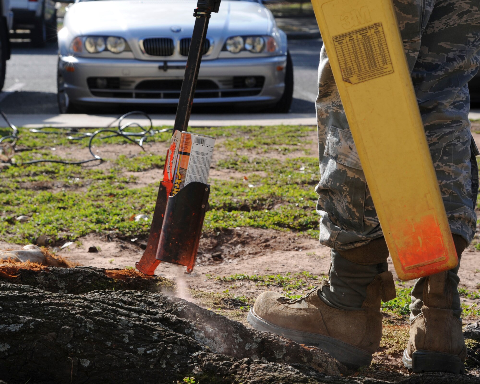 Airman 1st Class Tyler Tanner, 2nd Communications Squadron cable and antenna systems, marks buried cables with spray on Barksdale Air Force Base, La., Feb. 11, 2015. The spray is a permanent marking for construction workers to indicate the physical location of communication cables to prevent damage during excavation. 
(U.S. Air Force photo/ Senior Airman Jannelle Dickey)