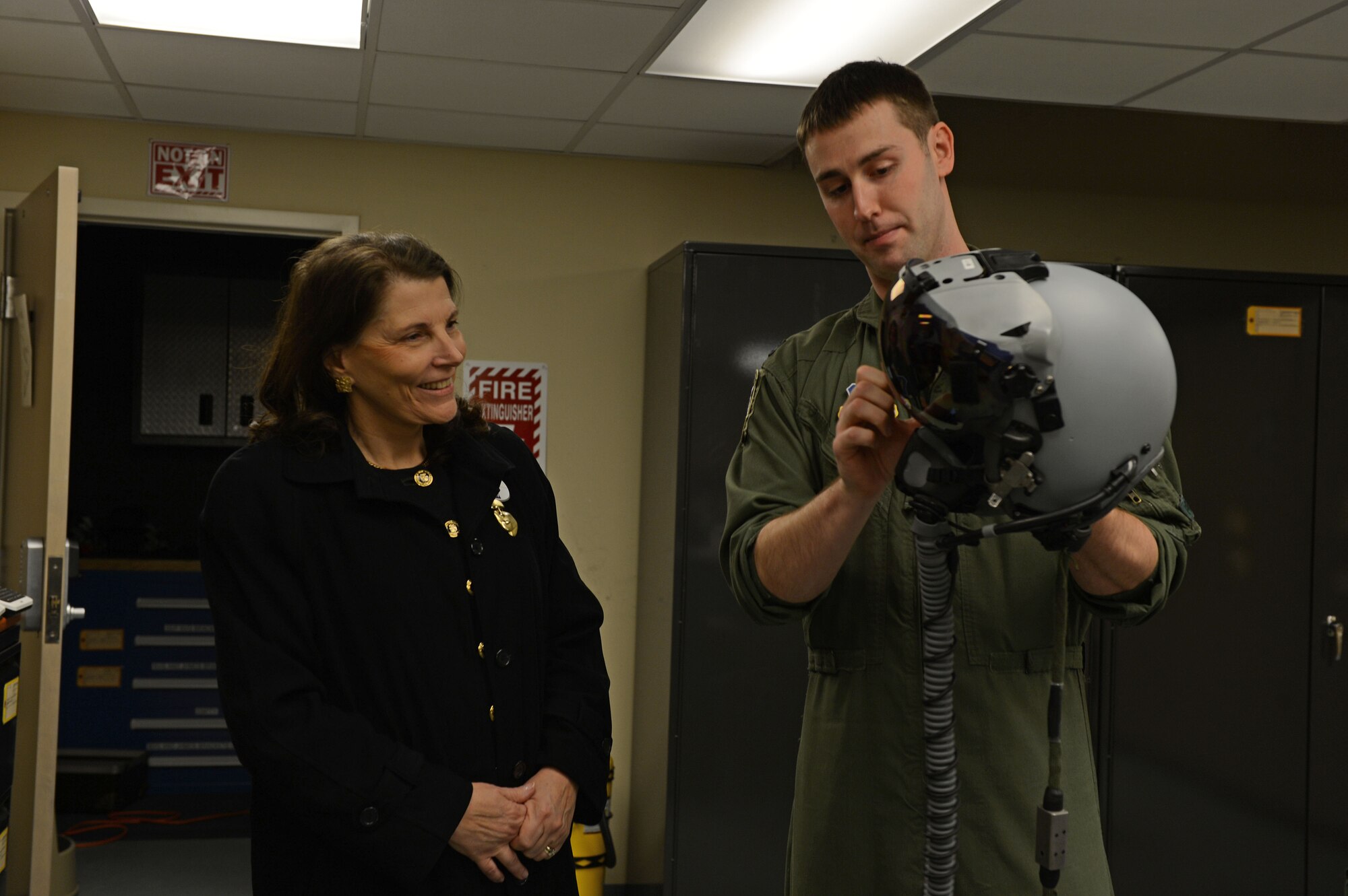 Mary Anne Fitzpatrick, dean of the College of Arts and Sciences at the University of South Carolina, is briefed by U.S. Air Force Capt. Brandon Dobbs, F-16CM Fighting Falcon pilot, at Shaw Air Force Base, S.C., Feb. 11, 2015. Fitzpatrick visited Shaw AFB to speak to Ninth Air Force senior leaders about diversity within USC and was provided a tour of the base afterwards. (U.S. Air Force photo by Senior Airman Jensen Stidham/Released) 