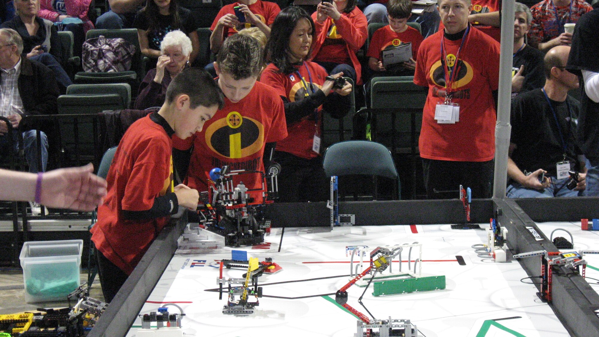 Second-place Champion’s Award – the “Incredibots” from Columbus – inspect their robotic entry during the FIRST LEGO League Ohio State Championship tournament at the Wright State University’s Nutter Center. The event hosted 50 top teams from around the state on Feb. 7-8. A team must have qualified from an Ohio district-level event to be invited to the state championship. (Air Force photo by Ted Theopolous)