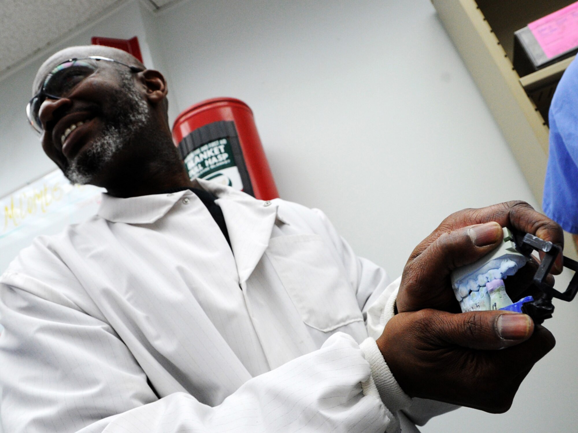 Michael McCombs, 779th Dental Squadron dental technician, shows the ceramic
crown designed using Computer Aided Design and Computer Aided Machining
technology on Joint Base Andrews, Md., Dec 1, 2014. Dental technicians are
using CAD/CAM technology to make daily operations more efficient and assist
Airmen in maintaining mission readiness. (U.S. Air Force photo/Staff Sgt.
Matt Davis)
