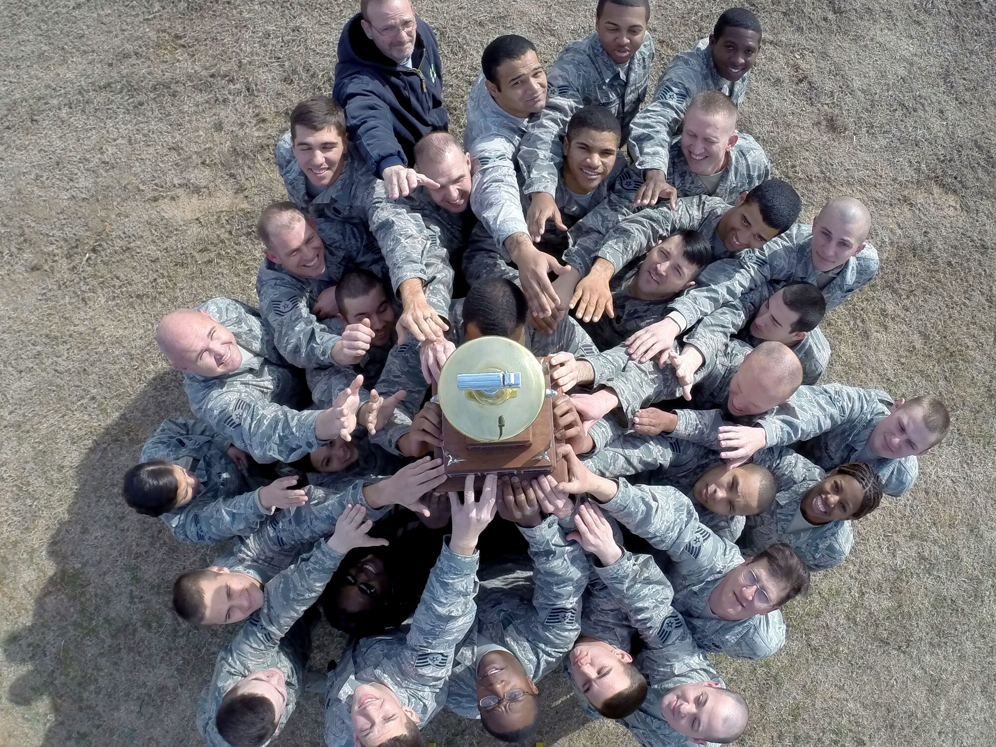 The 20th Logistic Readiness Squadron fuels management flight holds up the Air Combat Command Drake Trophy at Shaw Air Force Base, S.C., Feb. 6, 2015. The flight was awarded the trophy for the first time since its creation in 1992. (U.S. Air Force photo by Senior Airman Jensen Stidham/Released) 