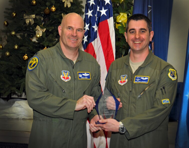Col. Michael Shenk, 111th Attack Wing Operations Group commander, hands an award to Senior Master Sgt. Robert Blankenship, 111th ATKW Operations Group superindentent, as the 111th Attack Wing recognized five 2014 Annual Award recipients during a ceremony held here Feb. 8, 2015 at the headquarters building, Horsham Air Guard Station , Pa. The categories in which the Guardsmen competed were Airman, Noncommissioned Officer, First Sergeant, Senior NCO and Company Grade Officer of the Year. The winners each received and plaque and certificate to recognize their achievements.(U.S. Air National Guard photo by Staff Sgt. Michael Stauffer/Released)