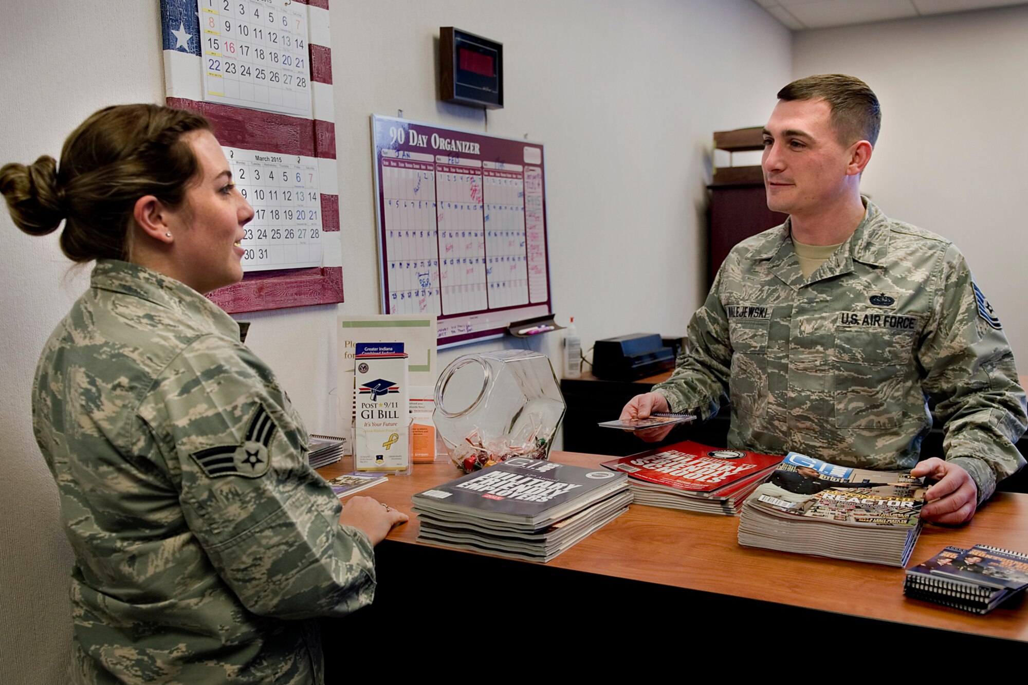 Tech. Sgt. James Walejewski, 434th Force Support Squadron training technician assists, Senior Airman Kara Kurtis, 434th Air Refueling Wing knowledge operations specialist, with education benefits guidance at Grissom Air Reserve Base, Ind., Feb. 7, 2015. Earlier that day, Walejewski used his Air Force self-aid-and-buddy-care training to provide care during a medical emergency at a local sandwich shop. (U.S. Air Force photo/Tech. Sgt. Benjamin Mota)