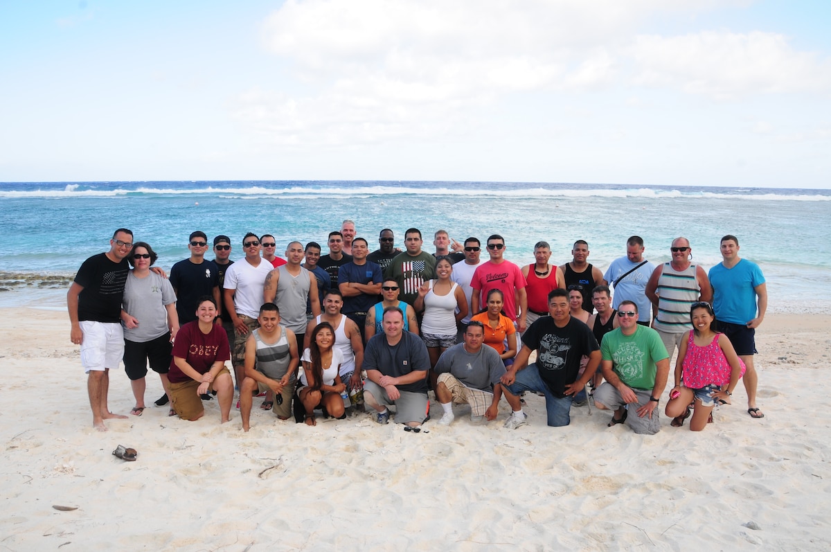 U.S. Air National Guard members from the 146th Airlift Wing Civil Engineering Squadron pose for a picture at Tarague Beach, Andersen Air Force Base Guam on February 11, 2015. The Airmen held a barbeque to celebrate the end of a successful TDY before departing back home. (U.S. Air National Guard photo by Airman 1st Class Madeleine Richards/Released)