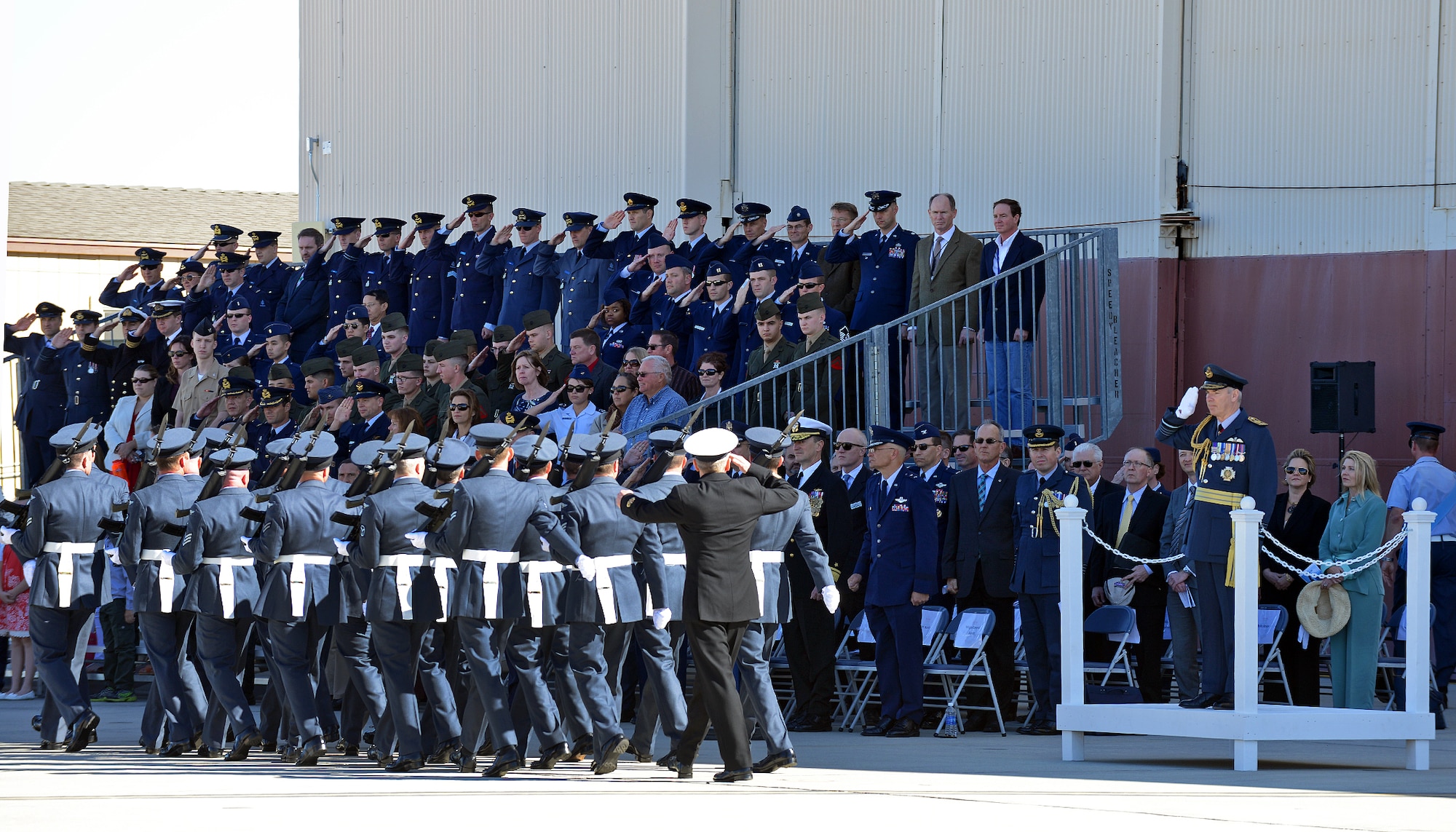Royal Air Force Chief of the Air Staff, Air Chief Marshal Sir Andrew Pulford reviews the parade during the RAF 17 (Reserve) Squadron centenary parade held at Edwards AFB on Feb. 9, 2015. Prior to the ceremony’s commencement, band members from the 3rd Marine Aircraft Wing were invited to be a part of the centenary parade, which was held in front of the squadron’s hangar and those in attendance, which included Air Force Test Center and 412th Test Wing leadership amongst many others, were also able to witness the parade general salute and parade review by the RAF Chief of the Air Staff. (U.S. Air Force photo by Jet Fabara)