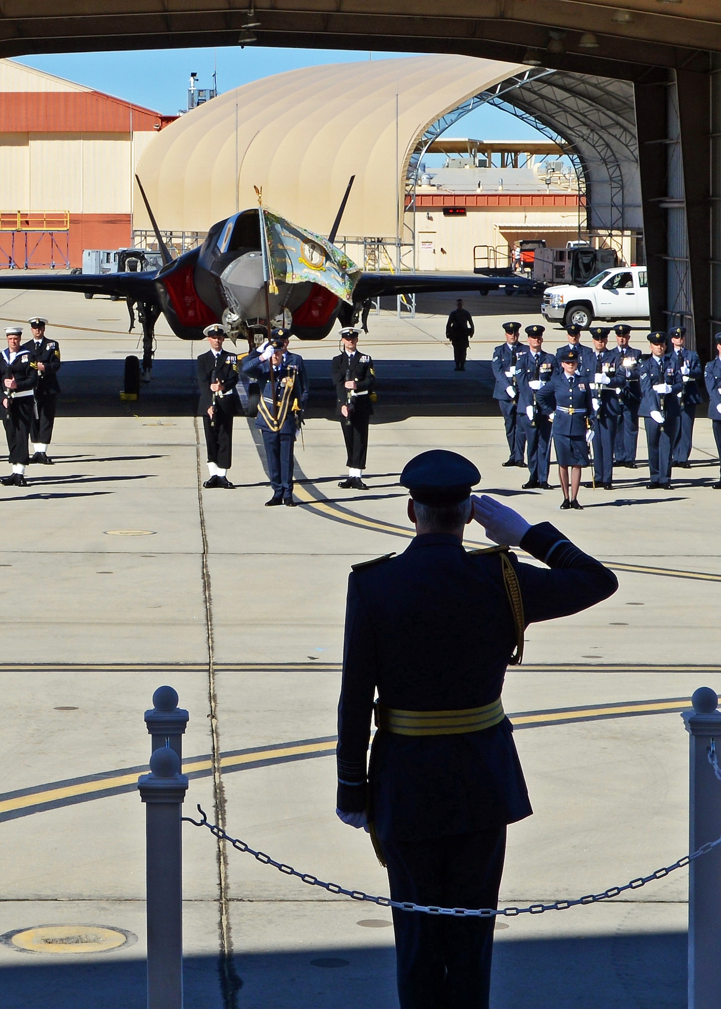 Royal Air Force Chief of the Air Staff Air Chief Marshal Sir Andrew Pulford takes the salute during the RAF 17 (Reserve) Squadron centenary parade held at Edwards on Feb. 9, 2015. During the ceremony, attendees were treated to a World War II-era Spitfire fly-over and an F-35 fly-over to recognize the squadron’s rich flying past and the squadron’s current standing up of F-35B operations out of Edwards. (U.S. Air Force photo by Jet Fabara)