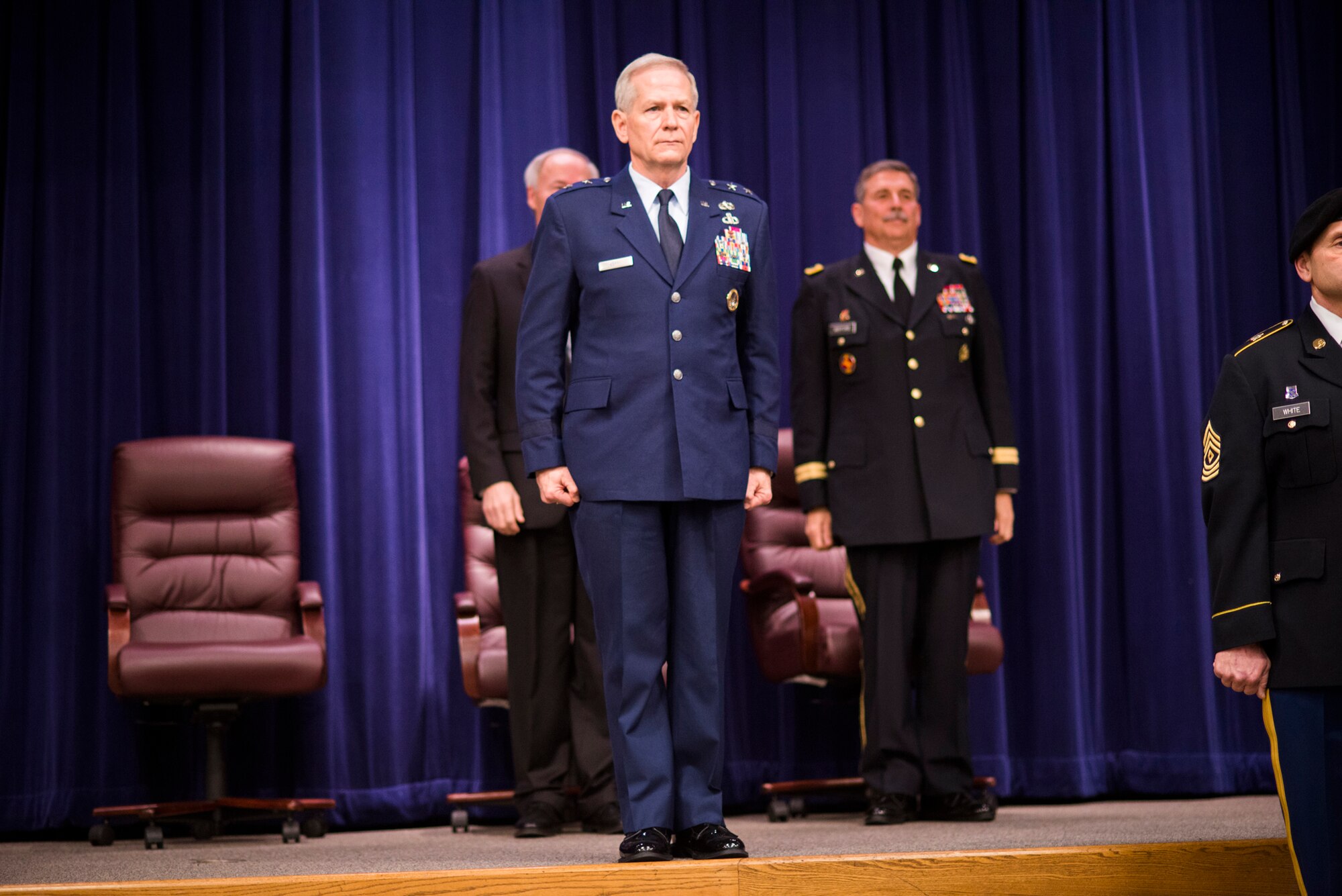 Maj. Gen. Mark Berry stands before the audience in recognition as the new Adjutant General of the Arkansas National Guard during change of command ceremonies at Camp Robinson on Saturday Feb. 7, 2015. (Photo taken by Senior Airman Ian Caple/released)