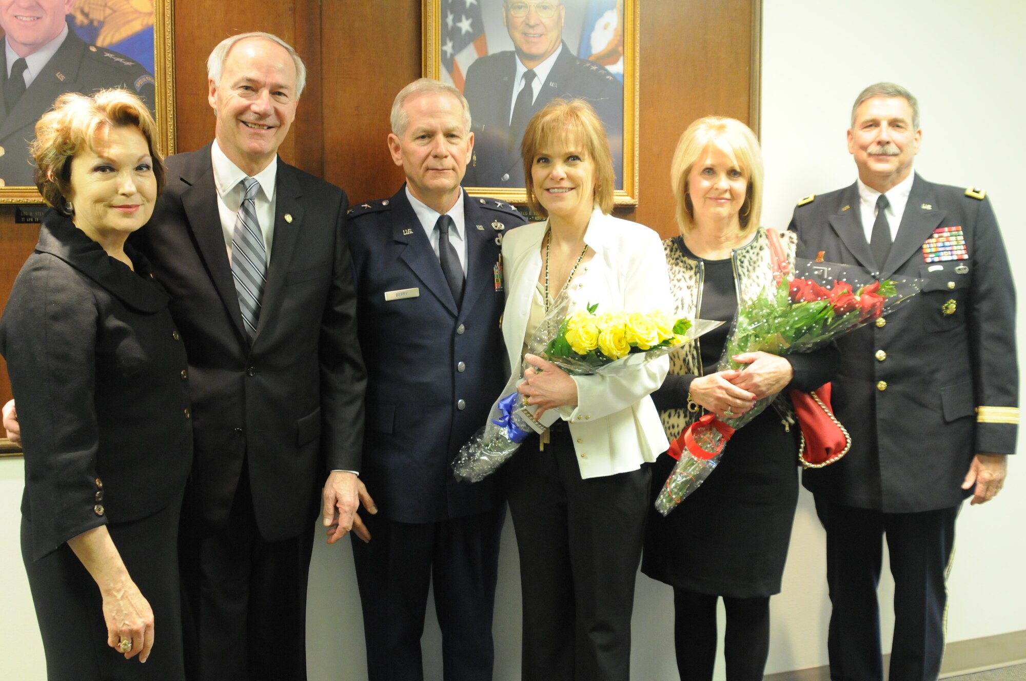 Gov. Asa Hutchinson (left, with spouse), visits Camp Robinson Saturday to honor newly appointed adjutant general Maj. Gen. Mark H. Berry (center, with wife) and outgoing adjutant general Maj. Gen. William D. Wofford (right, with spouse) who retired today. (Photo taken by Sgt. Alejandro Smith-Antuna/released)