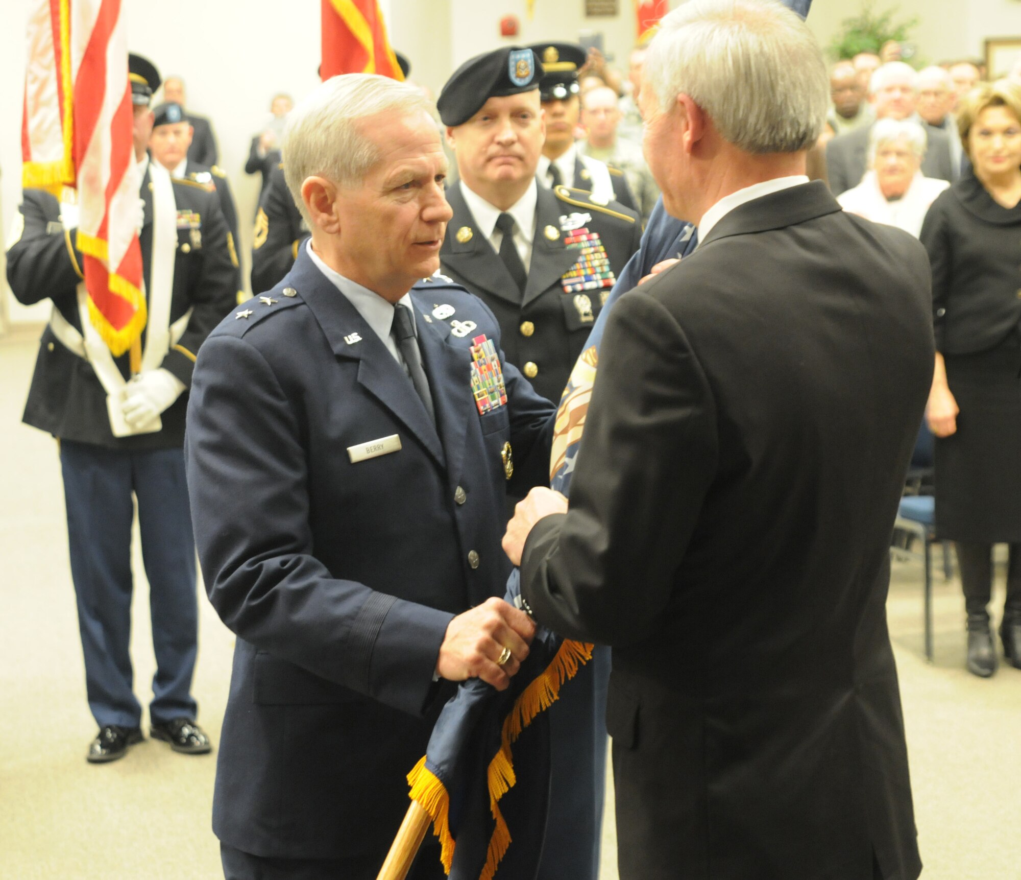 Maj. Gen. Mark H. Berry, the newly appointed adjutant general of the Arkansas National Guard, receives the flag from Governor Asa Hutchinson, symbolizing his assumption of command during a ceremony here. “It is a sincere honor for me to be a part of this team, and it is with great pride that I entrust [Maj.] Gen. Berry with this professional military organization,” reflected Wofford. “I am honored, privileged and humbled to have had the opportunity to help lead this most awesome group of military professionals, our citizen soldiers and airmen.” (Photo taken by Sgt. Alejandro Smith-Antuna/released)