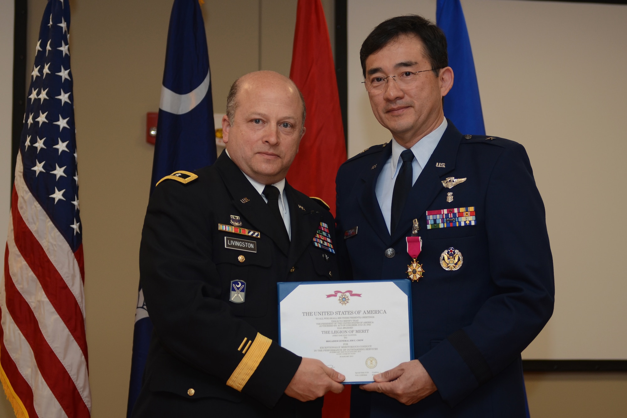 U.S. Army Maj. Gen. Robert E. Livingston Jr (left), the Adjutant General for South Carolina, presents the U.S. Air Force Legion of Merit to U.S. Air Force Brig. Gen. (Dr.) Jim Chow, the State Air Surgeon and Assistant to the Director of the Air National Guard, at McEntire Joint National Guard Base, Feb. 8, 2015. Brig. Gen. Chow retired with thirty years of service to the South Carolina Air National Guard and the 169th Fighter Wing. (U.S. Air National Guard photo by Senior Master Sgt. Edward Snyder/Released)