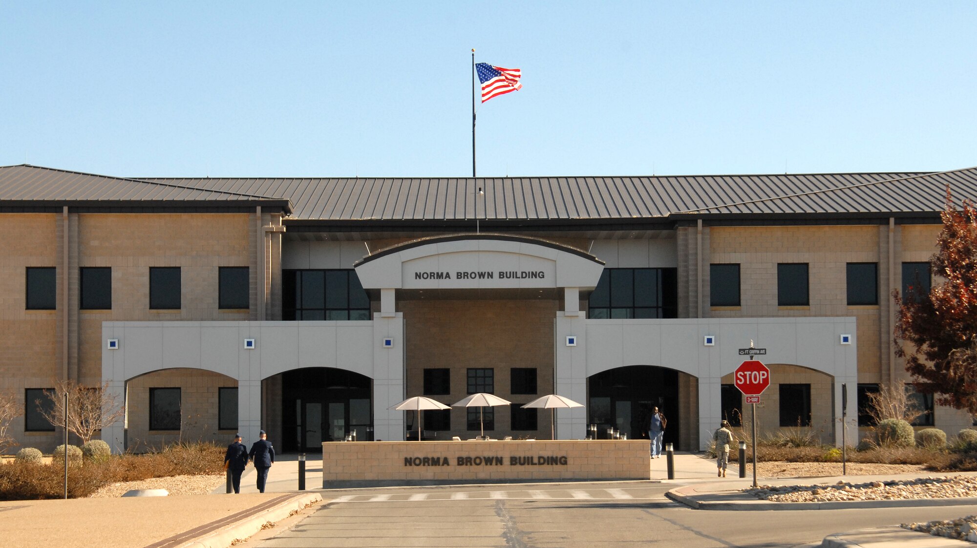 GOODFELLOW AIR FORCE BASE, Texas - The base flag flies above the Norma Brown Building, headquarters of the 17th Training Wing, as it stands Feb. 11. 17 TRW retreat ceremonies are held here every quarter and are conducted by 17th Training Wing groups at the base flagstaff. (U.S. Air Force photo/ Robert D. Martinez)