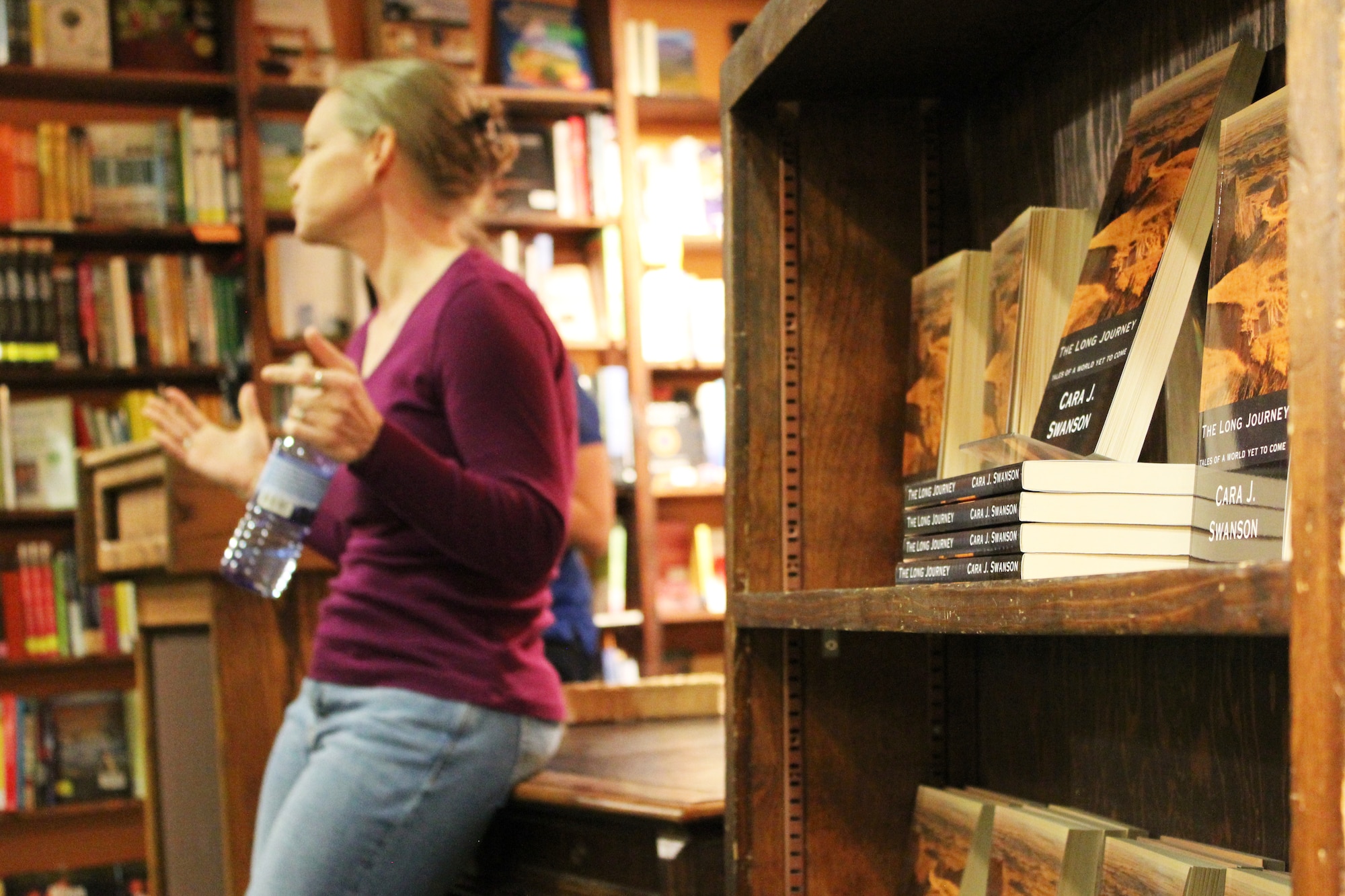 Capt. Cara J. Swanson, an Individual Mobilization Augmentee assigned to the 566th Intelligence Squadron, discusses her recently published novel, The Long Journey, Tales from a World Yet to Come, at Denver-area bookstore, the Tattered Cover, Jan. 27. The science fiction novel won second place in the 2014 Kindle Awards Best Fiction category.