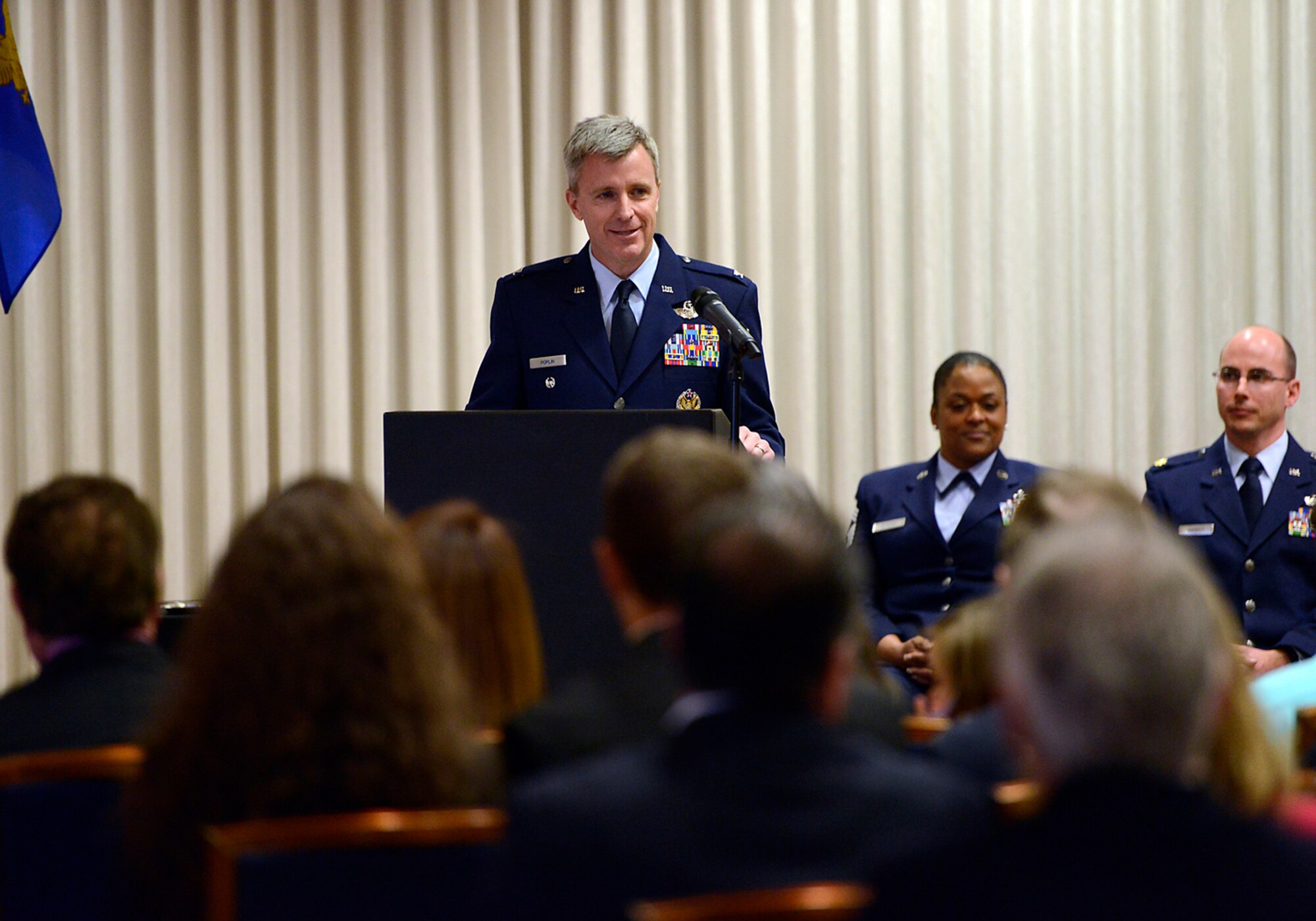 Col. Rick Poplin addresses family, friends and members of his unit after accepting command of the 138th Operations Group, Feb. 8, 2015, Tulsa Air National Guard base, Tulsa, Okla.  The ceremony was officiated by Col. David B. Burgy, 138th Fighter Wing commander and was held during the wing's February unit training assembly.  (U.S. National Guard photo by Master Sgt.  Mark A. Moore/Released)