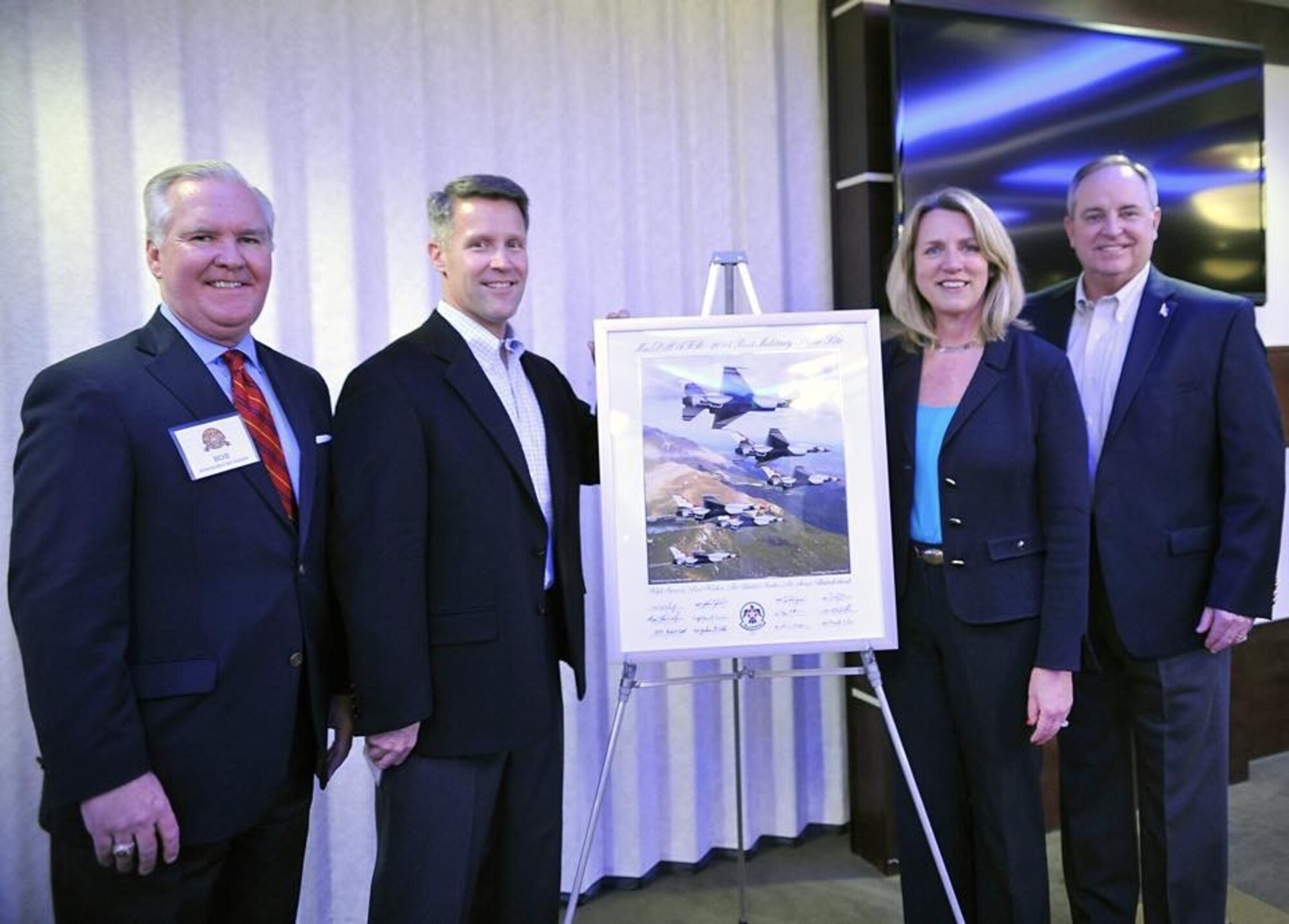 (From left) Tampa Mayor Bob Buckhorn, Col. Daniel Tulley, 6th Air Mobility Wing Commander, Secretary of the Air Force Deborah Lee James, and Chief of Staff of the Air Force Gen. Mark A. Welsh III, stand next to the 2014 “Best Military Show Site” award given by the U.S. Air Force Thunderbirds, Feb. 9, 2015. Commemorating the event was Secretary of the Air Force James, who presented Mayor Buckhorn with the award. (U.S. Air Force photo by Staff Sgt. Dana Flamer/Released)
