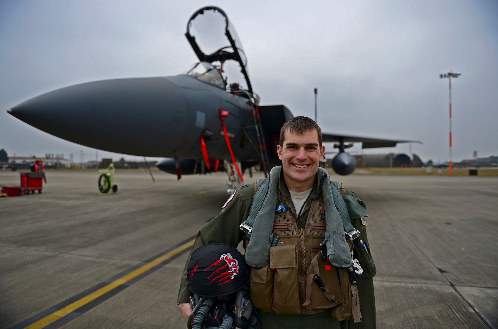 Capt. Thomas Meyer, 494th Fighter Squadron F-15E Strike Eagle pilot, poses in front of a jet at Royal Air Force Lakenheath, England, Feb. 11, 2015. Meyer was nominated for a Liberty Spotlight because he embodies the core value of Service Before Self. (U.S. Air Force photo by Airman 1st Class Erin R. Babis/Released)