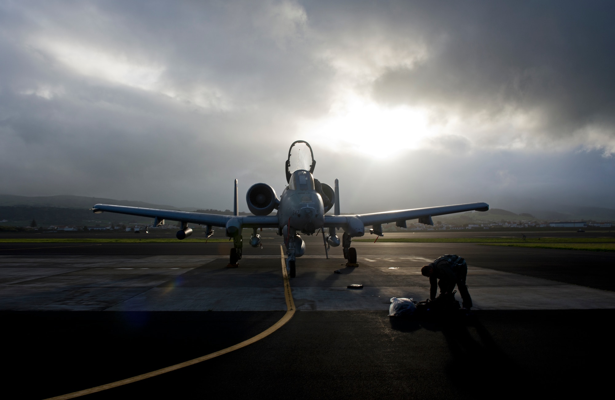 An A-10 Thunderbolt II pilot collects his things on the flight line at Lajes Field, Azores, Portugal, Feb. 11, 2015. The A-10s are being deployed as part of a Theater Security Package in support of Operation Atlantic Resolve.  Theater Security Package deployments and combined training with our allies and partners demonstrate that we share a commitment to promoting a peaceful and stable Europe. The A-10s and Airmen are deploying from the 355th Fighter Wing, Davis-Monthan AFB, Ariz.  (U.S. Air Force photo/Staff Sgt. Zachary Wolf)