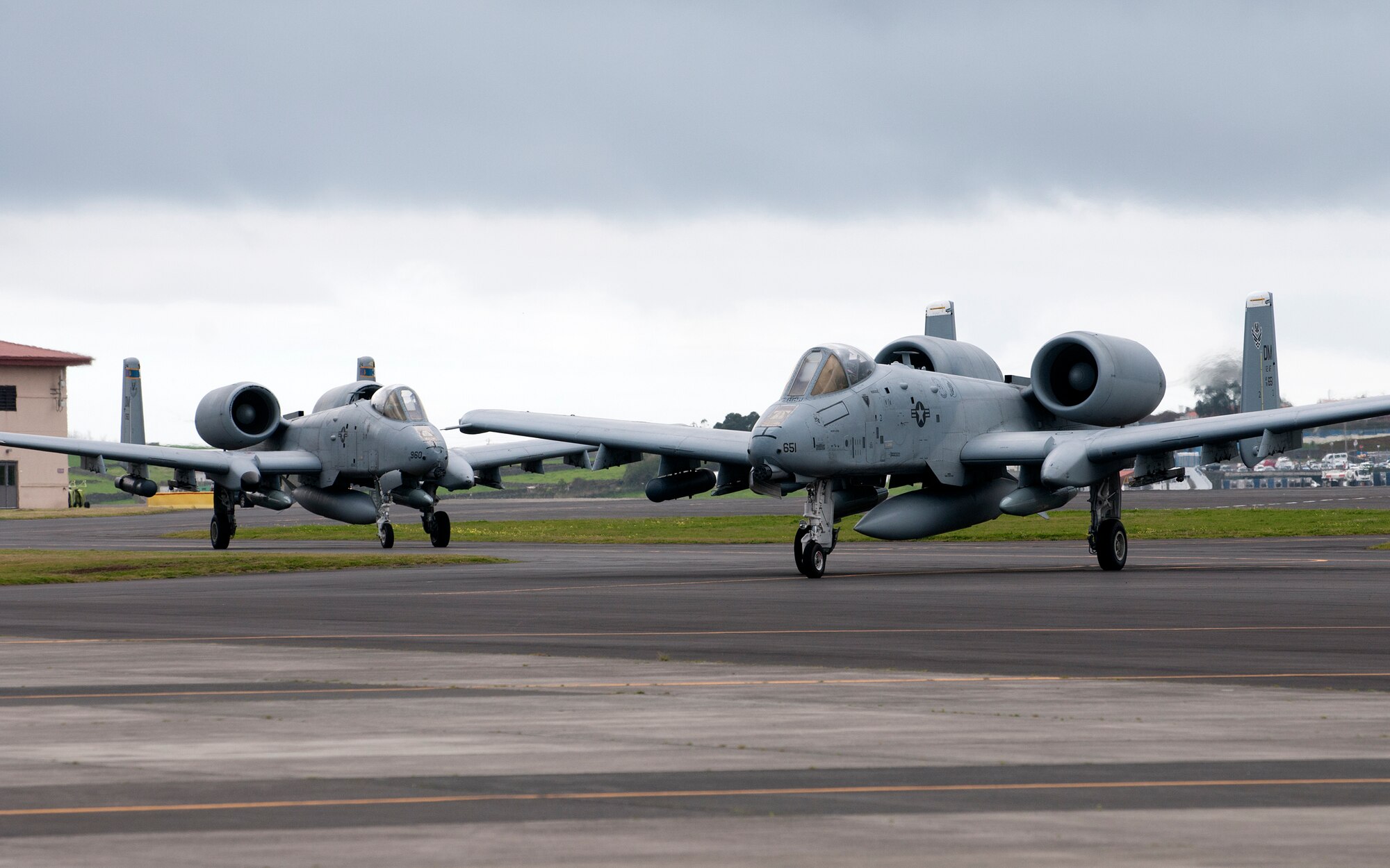 Two A-10 Thunderbolt IIs taxi on the flight line at Lajes Field, Azores, Portugal, Feb. 11, 2015. The A-10s are being deployed as part of a Theater Security Package in support of Operation Atlantic Resolve.  Theater Security Package deployments and combined training with our allies and partners demonstrate that we share a commitment to promoting a peaceful and stable Europe. The A-10s and Airmen are deploying from the 355th Fighter Wing, Davis-Monthan AFB, Ariz.  (U.S. Air Force photo/Staff Sgt. Zachary Wolf)