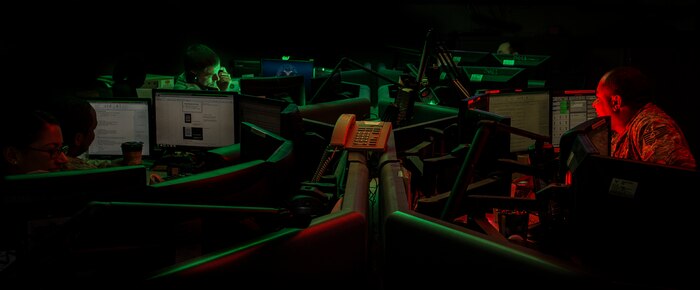 JOINT BASE CHARLESTON, S.C. – Airmen answer phones and track transient aircraft flight information in the Joint Base Charleston Command Post Feb. 11, 2015. The CP coordinates both military and community aide.  When incidents happen on or off base, controllers are normally the first to know.  Controllers become the hub in a crisis and provide vital information to the commanders across JB Charleston. The controllers currently work 12-hour shifts. (U.S. Air Force photo/ Senior Airman Dennis Sloan)