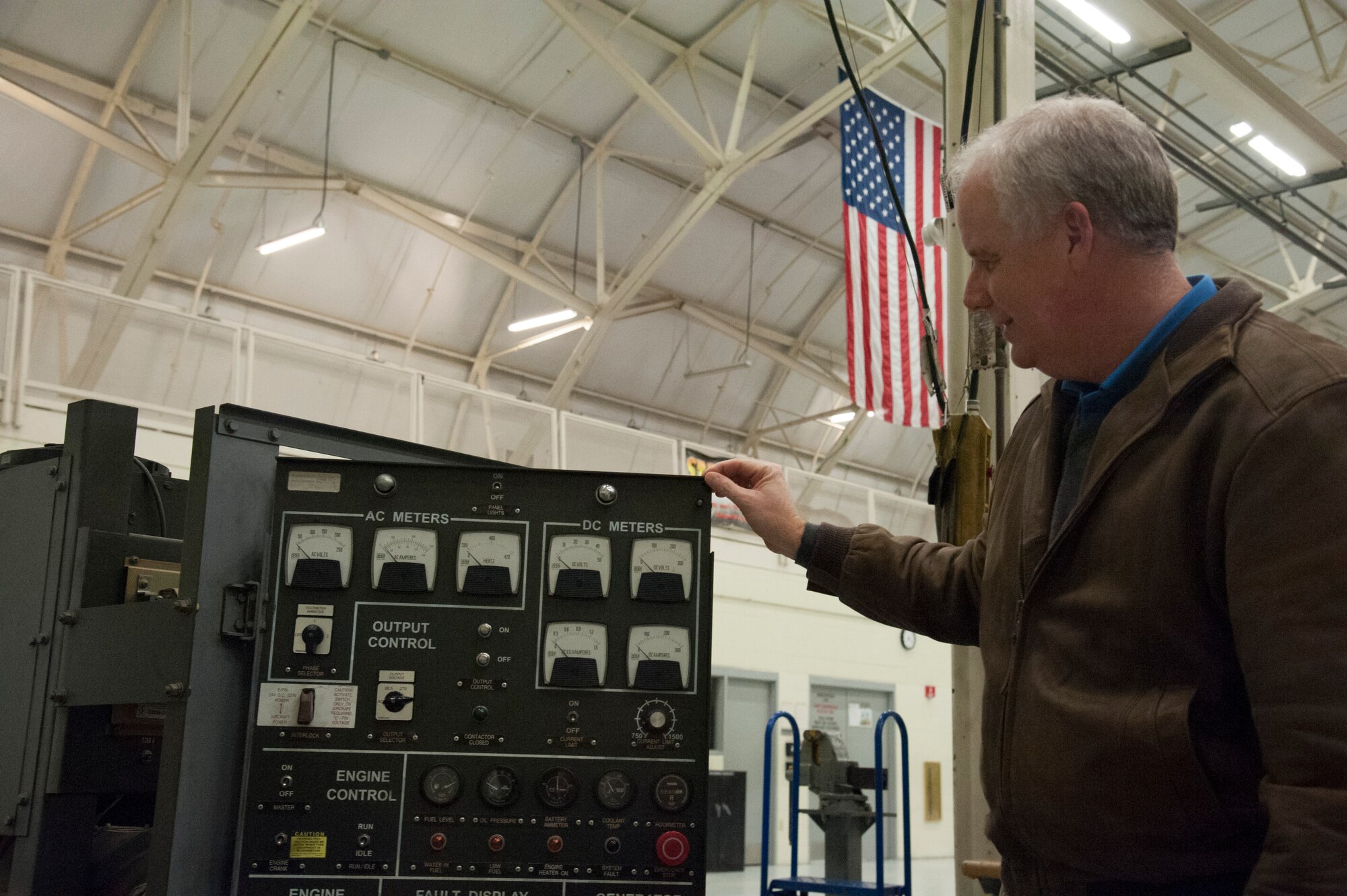 JOINT BASE CHARLESTON, S.C. – Marc Tye, Joint Base Charleston Advisory Council member, examines an ESSEX Generator during a tour for community leaders Feb. 11, 2015 at Joint Base Charleston, S.C. The tour exposed the leaders to the important contributions of Charleston’s Nighttime Warriors. (U.S. Air Force Photo/Capt. Christopher Love)
