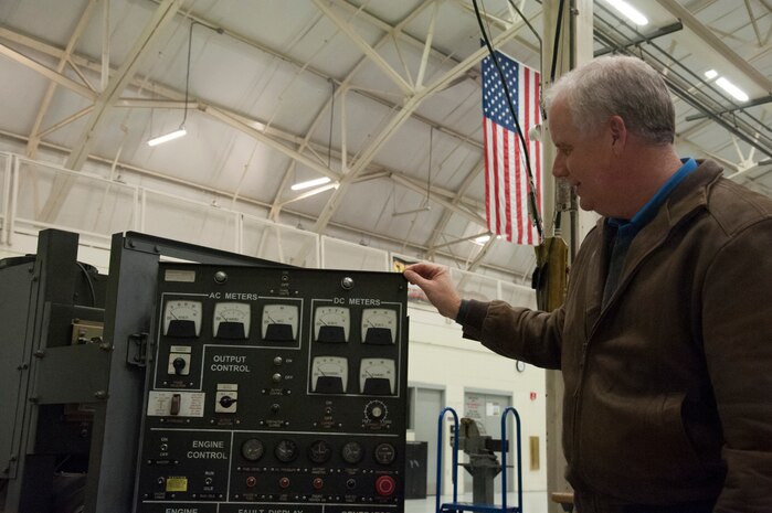 JOINT BASE CHARLESTON, S.C. – Marc Tye, Joint Base Charleston Advisory Council member, examines an ESSEX Generator during a tour for community leaders Feb. 11, 2015 at Joint Base Charleston, S.C. The tour exposed the leaders to the important contributions of Charleston’s Nighttime Warriors. (U.S. Air Force Photo/Capt. Christopher Love)
